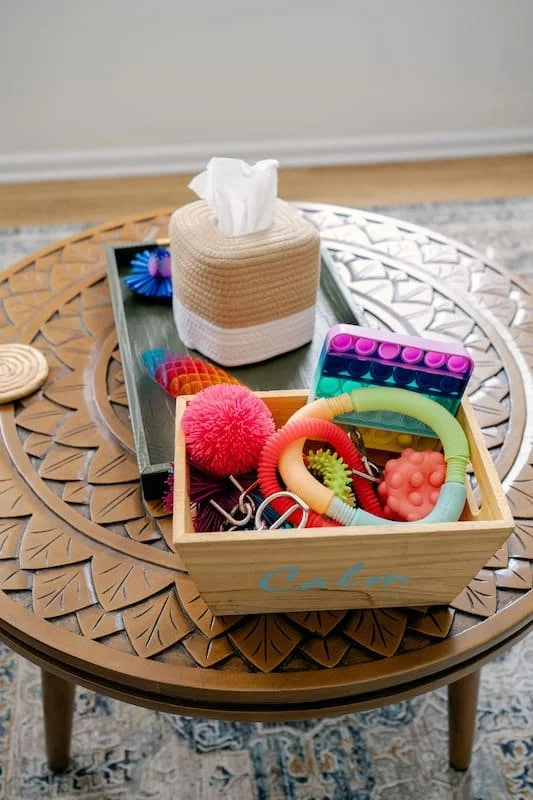 a table with a box of kleenex and tools