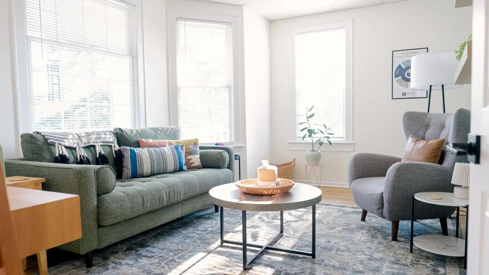 Reset Brain and Body office with green couch and windows