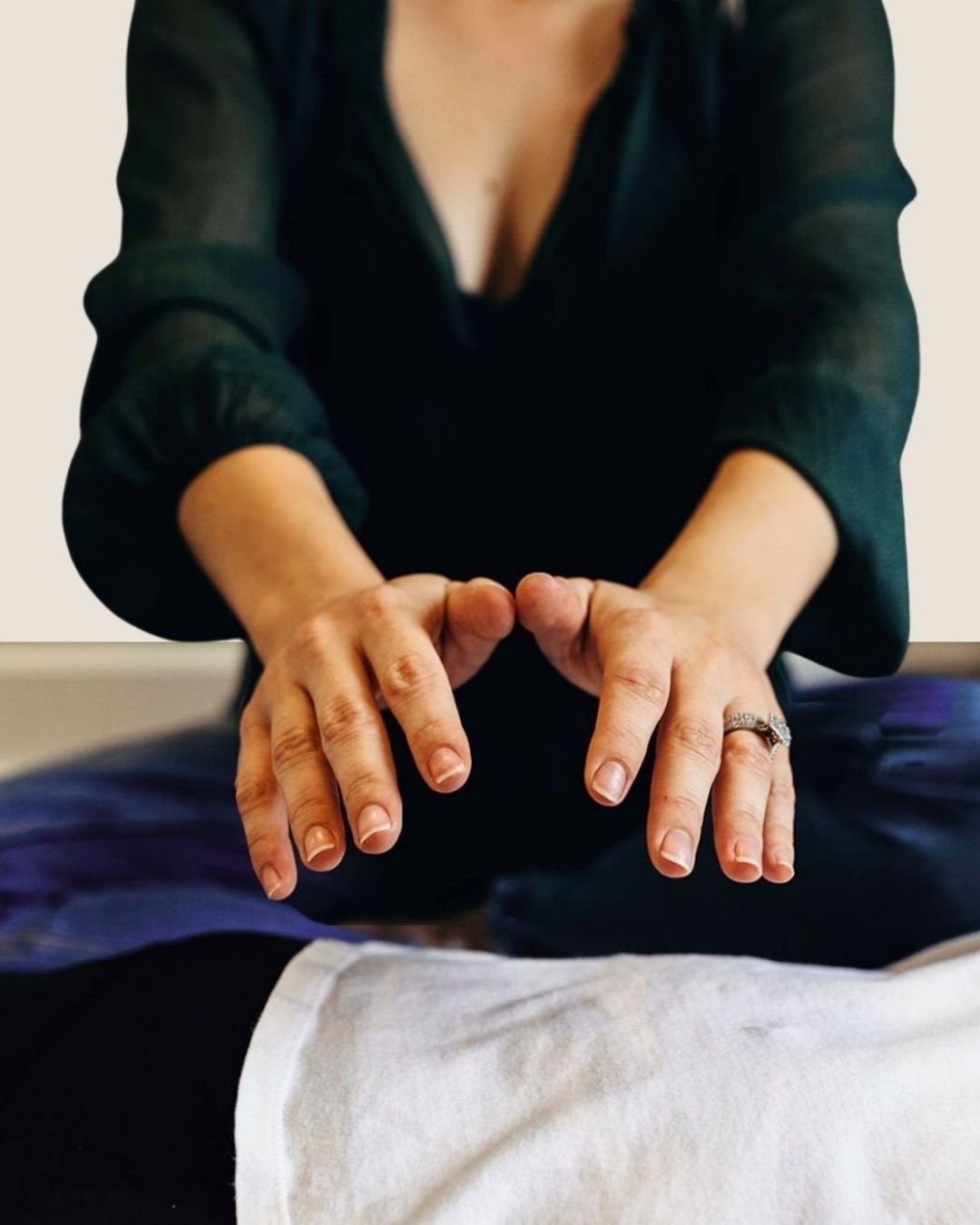 Healing hands hovering above someones back performing somatic therapy