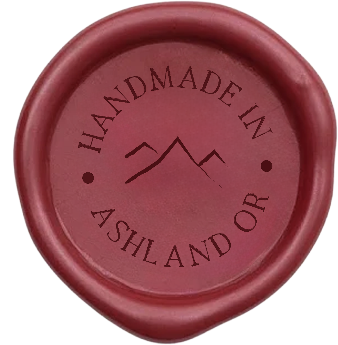 Red wax seal with a mountain design and the text 'Handmade in Ashland OR' circling the mountain.