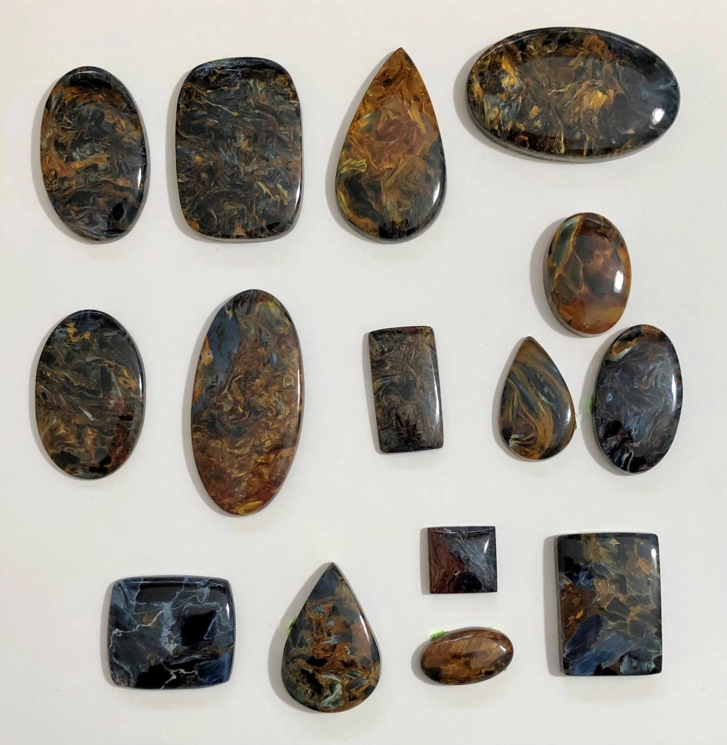 Collection of Namibian pietersite cabochons ready to be used for jewelry