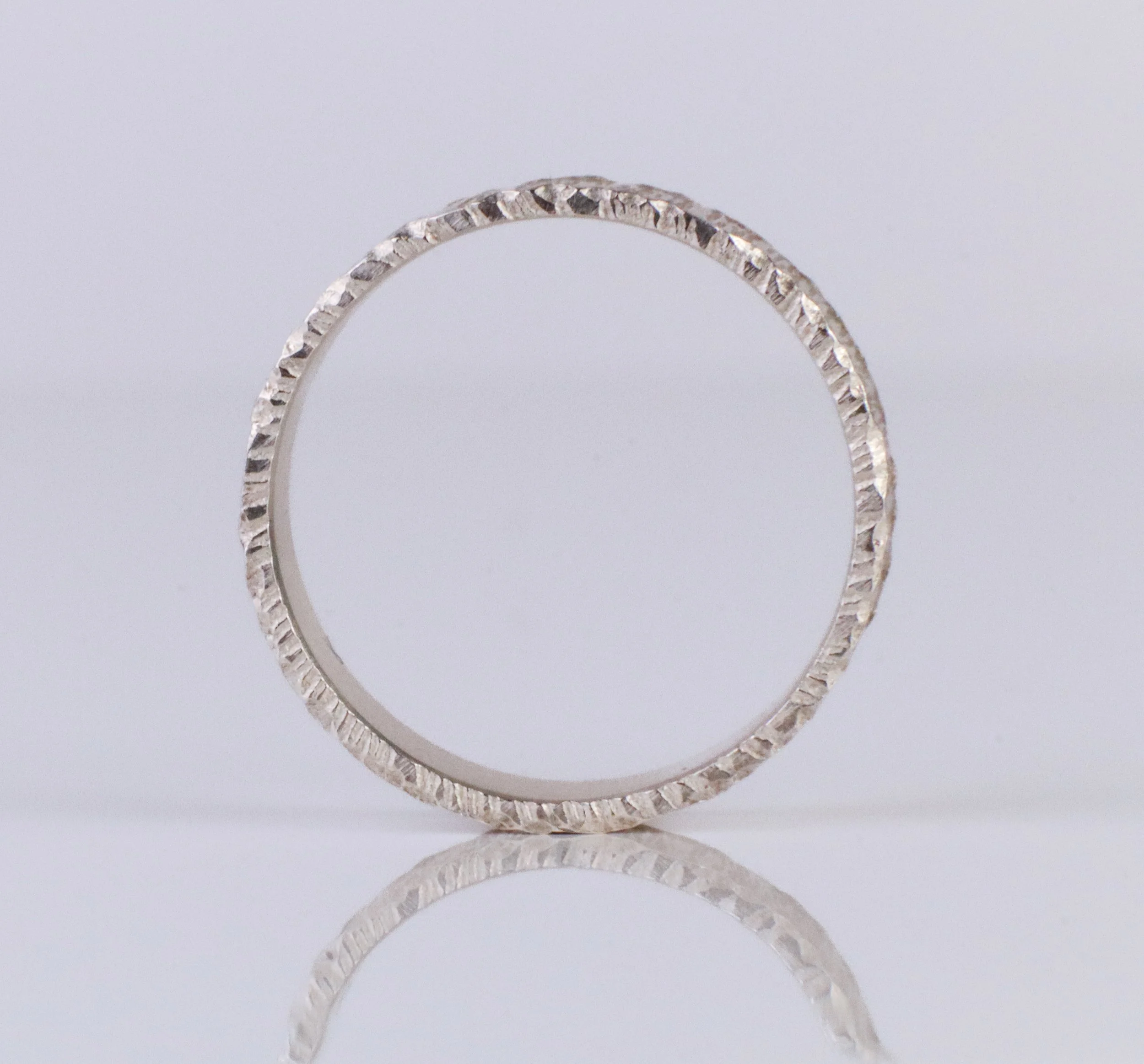Silver artisan ring with raw cut edge