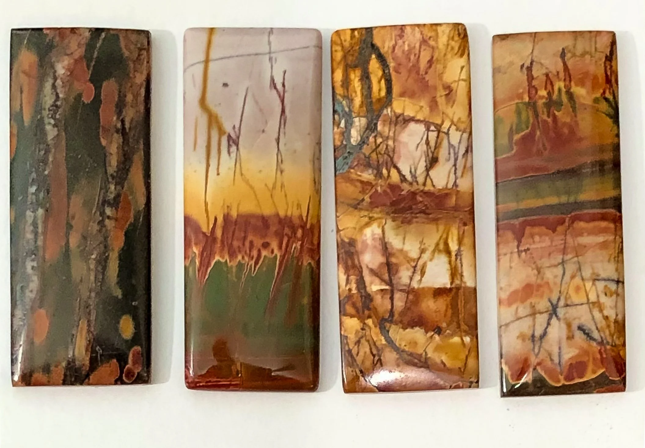 rectangle cut cabochons of Cherry Creek Jasper that look like paintings