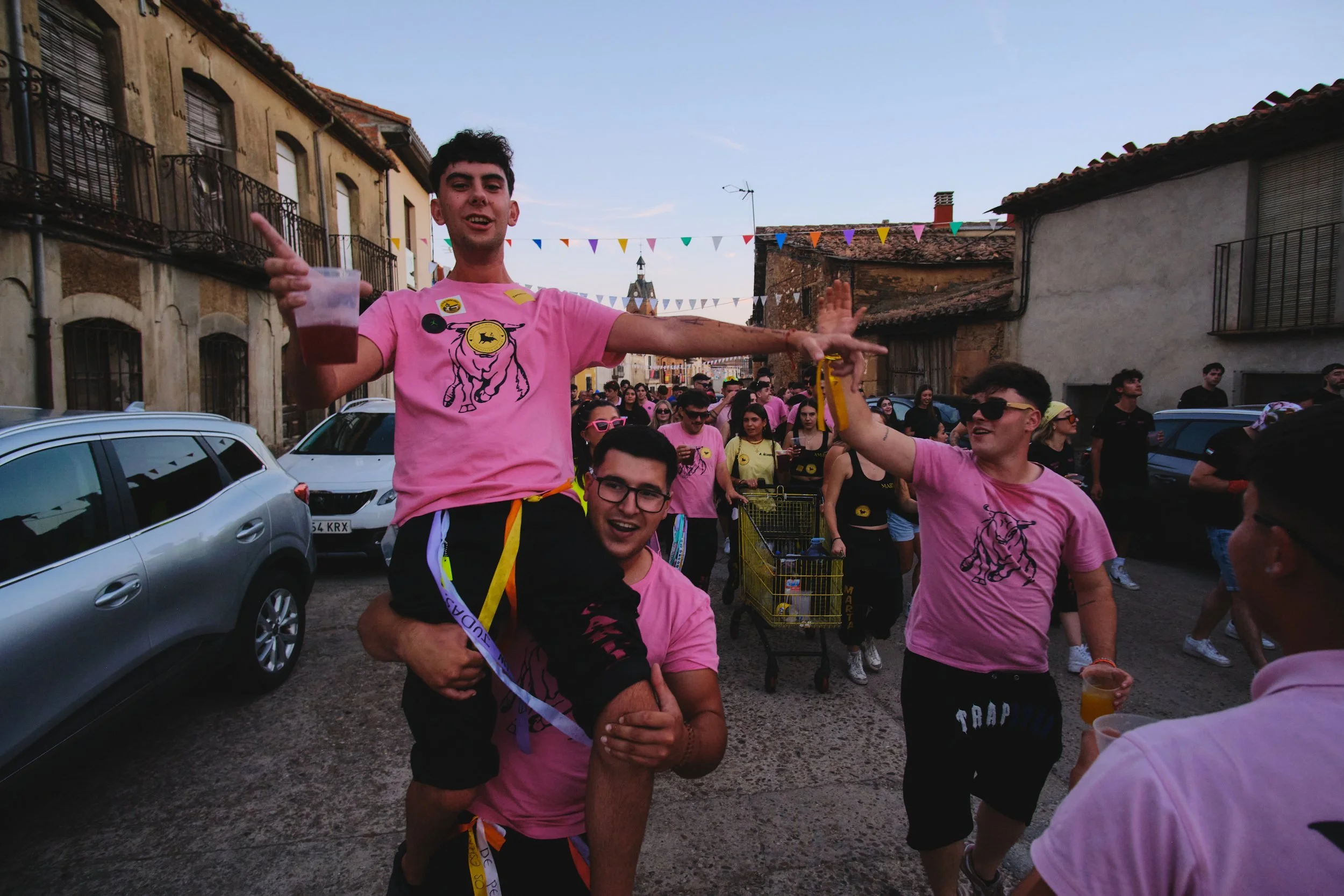 Peña group parading through a village fiesta in Spain