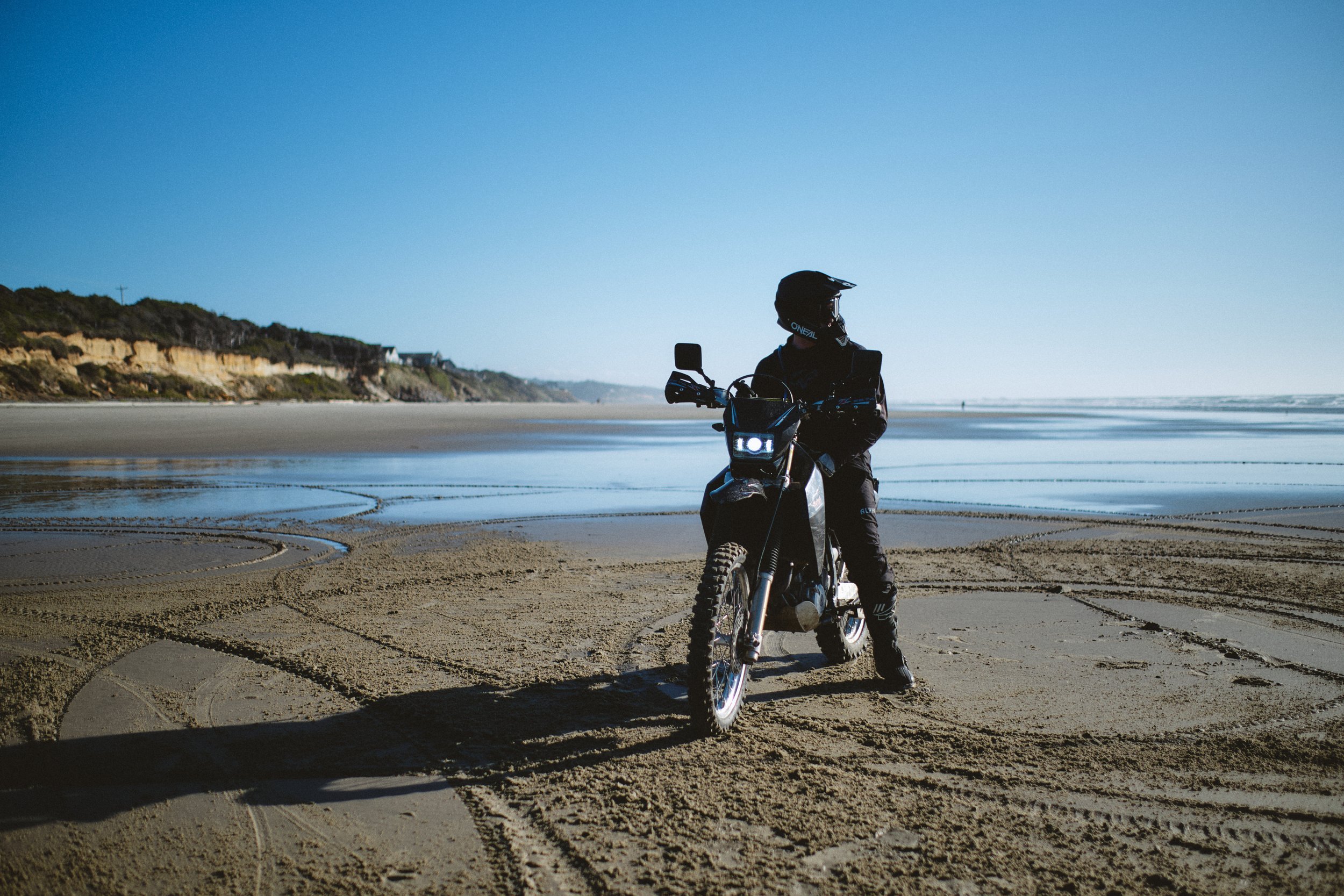 Motorcycle rider on the beach on the Oregon coast