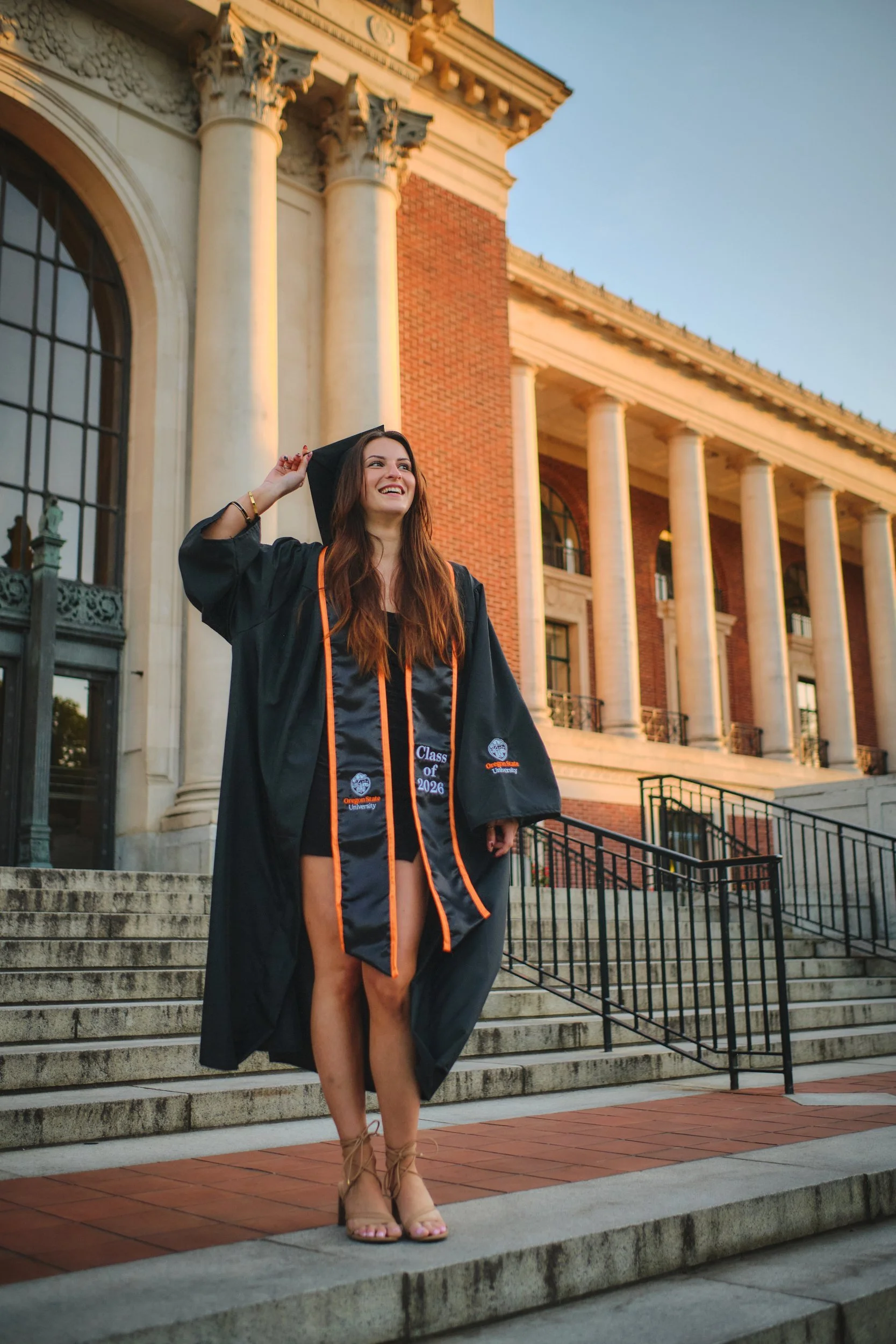 Oregon State graduate on the Memorial Union steps in Corvallis