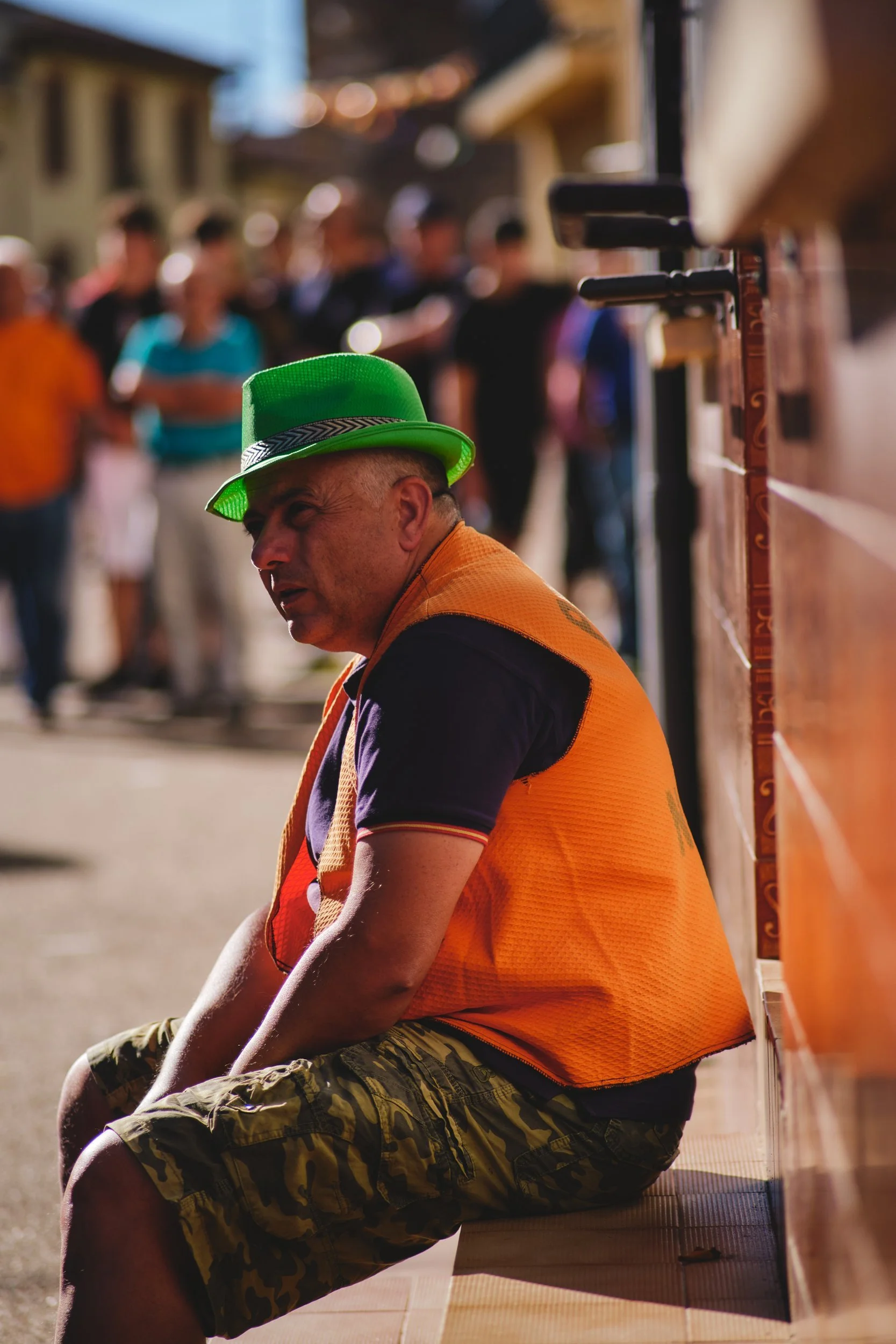 Man in a green hat at a village fiesta in Spain