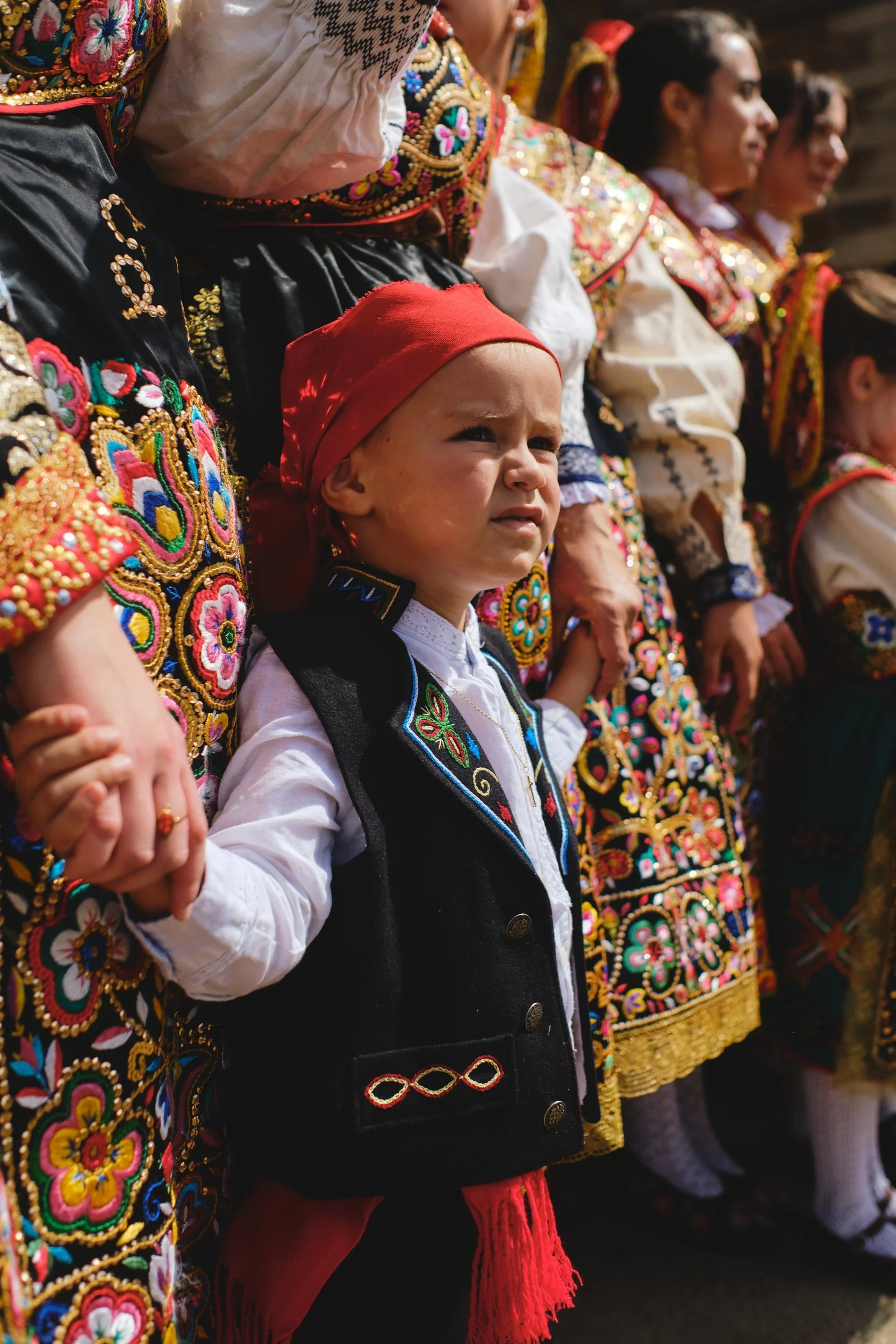 Child in traditional dress at a village festival in Spain