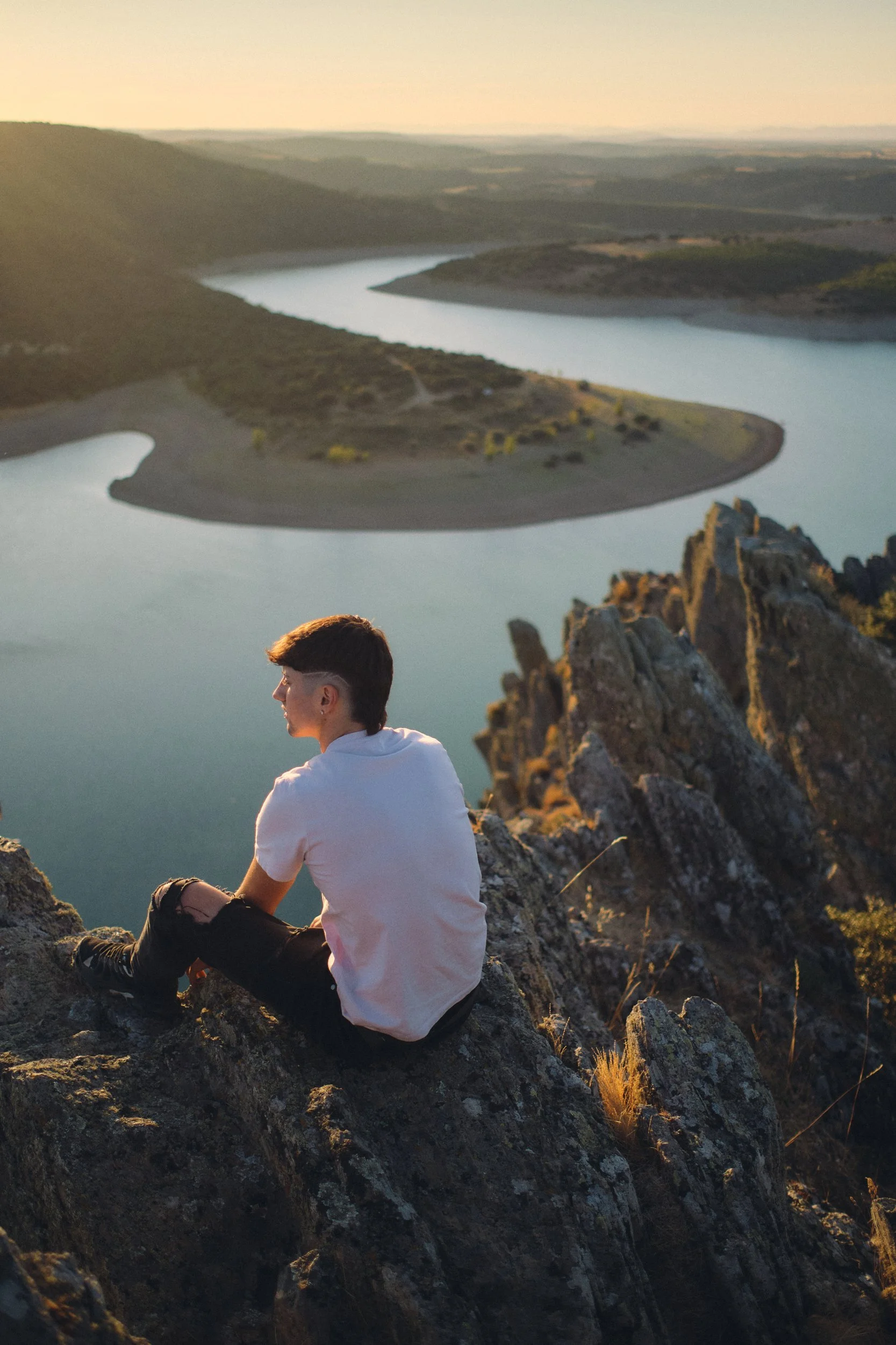 Portrait at a river overlook at golden hour in Spain