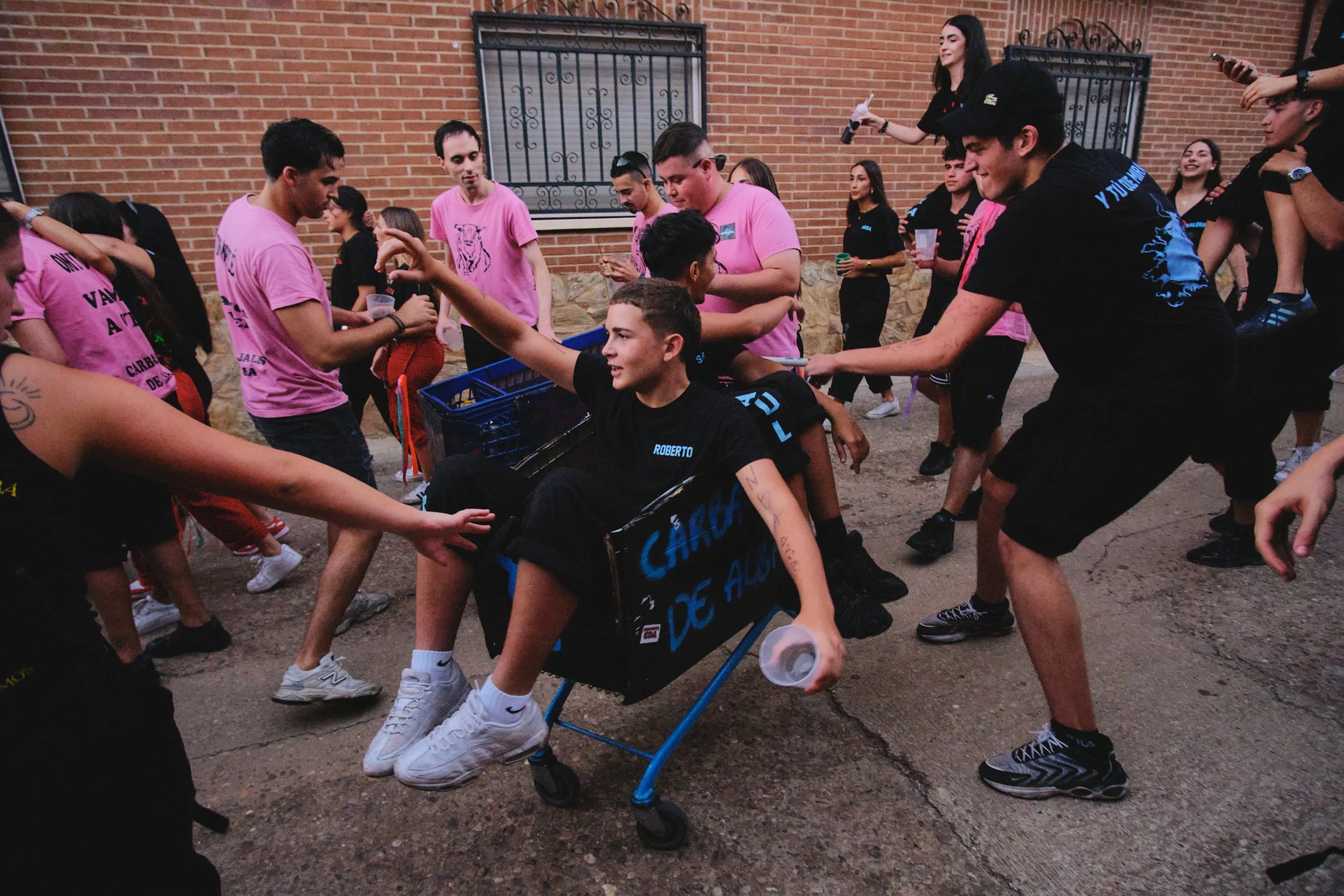Shopping cart parade during a village fiesta in Spain
