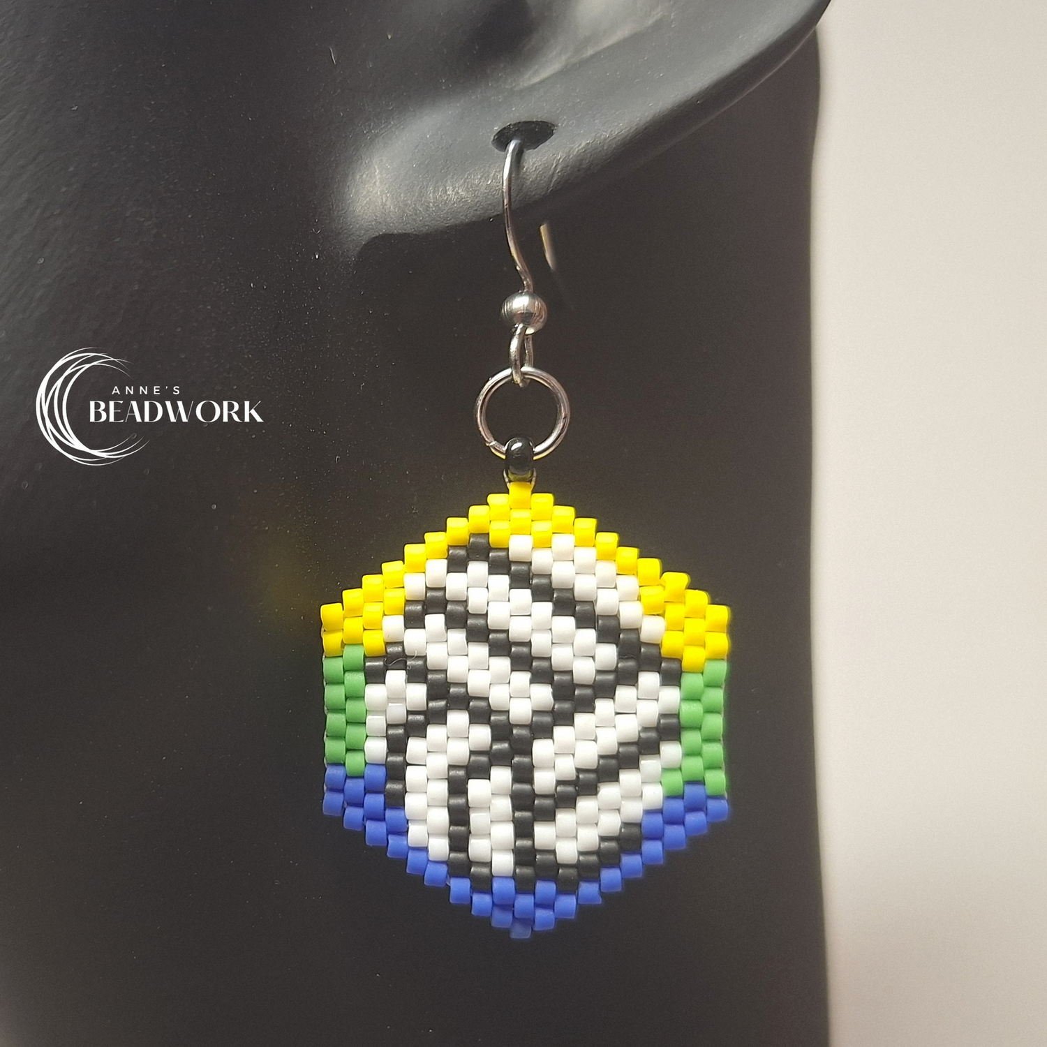 Hexagon_Earrings_Flags_Volleyball_Corozal_20260814_Hanging.jpg