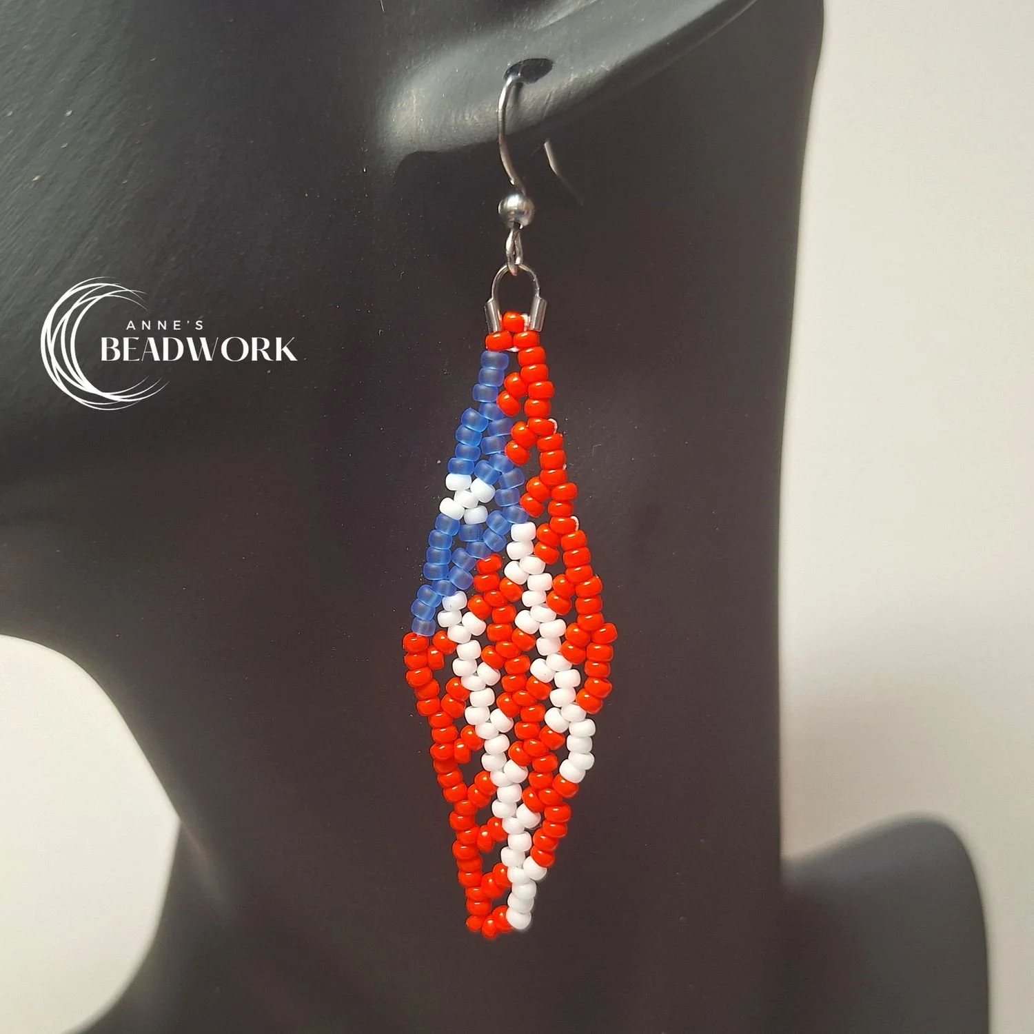 Feather_Earrings_Flags_Puerto_Rico_MediumBlue_Medium_20260814_Hanging.jpg