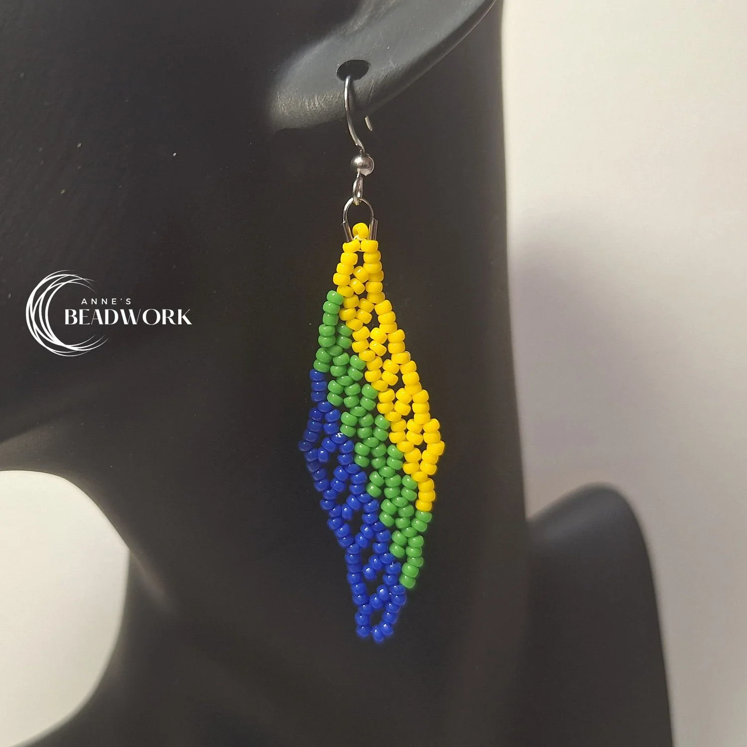 Feather_Earrings_Flags_Corozal_Medium_20260814_Hanging.jpg
