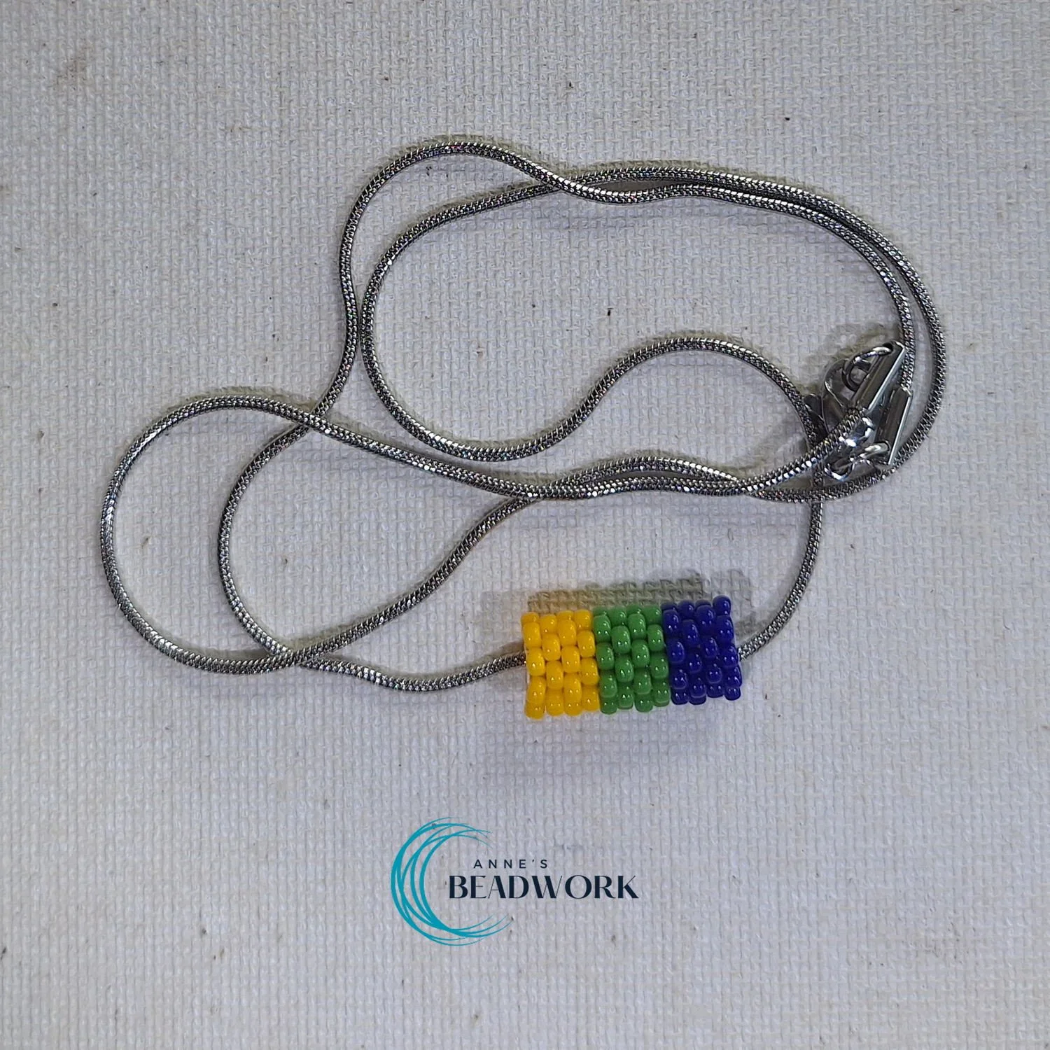 Corozal Flag Glass Seed Bead Barrel Necklace