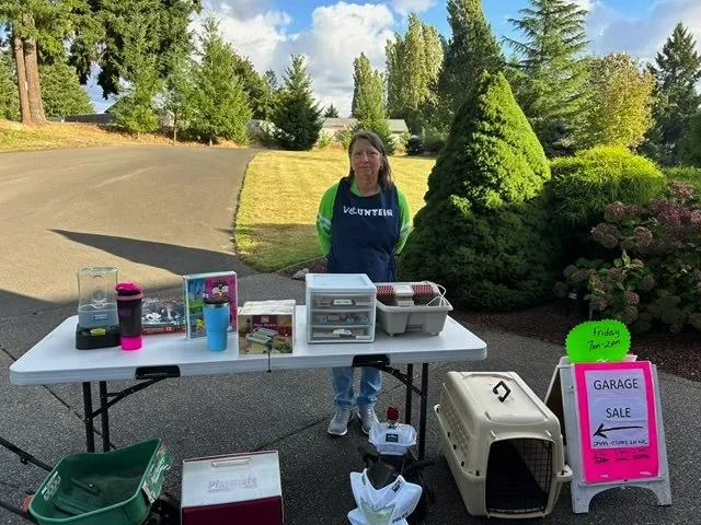 Janine at her Garage Sale supporting Friends of JAS