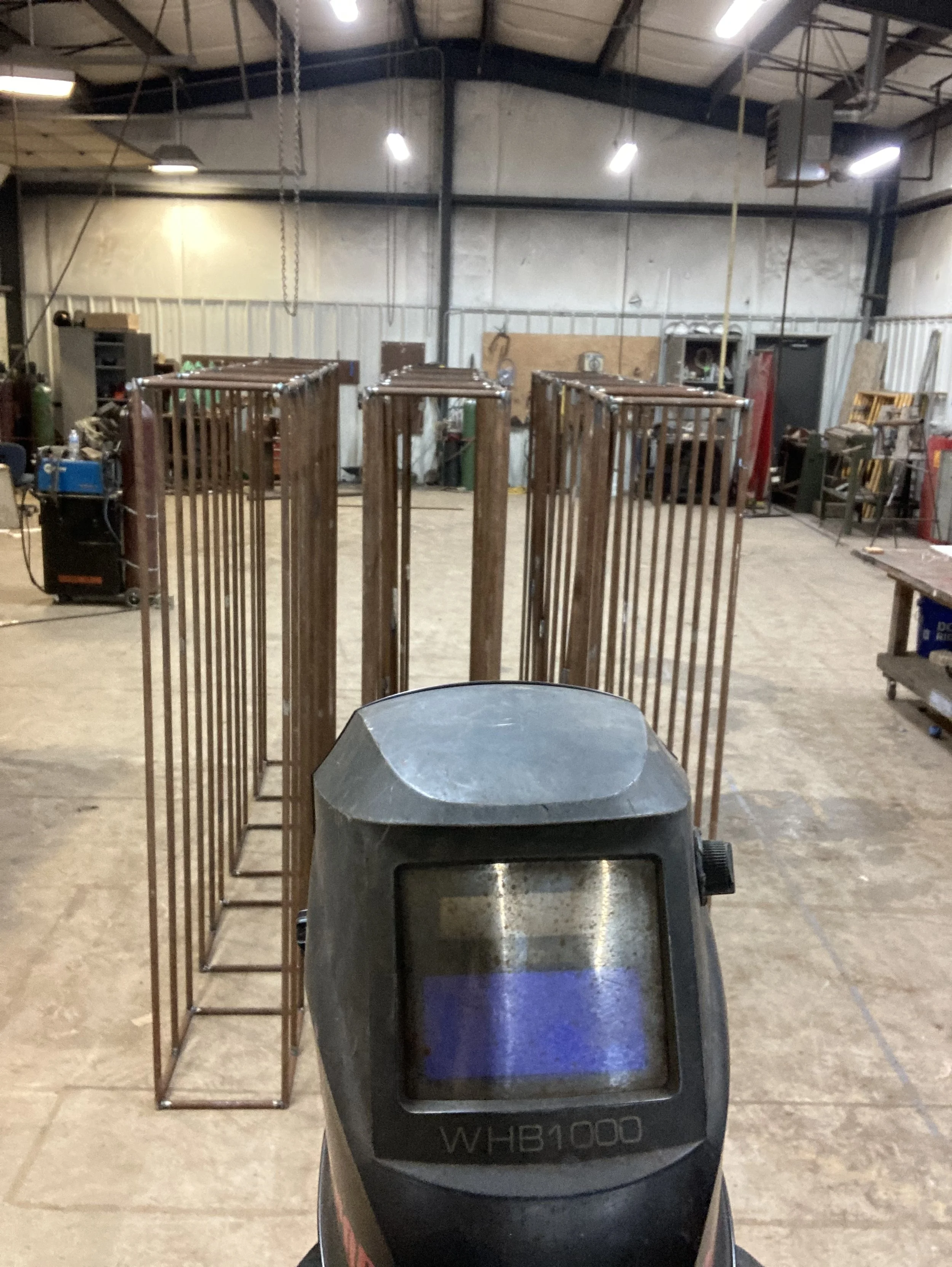 Steel cages I welded for our firewood wall
