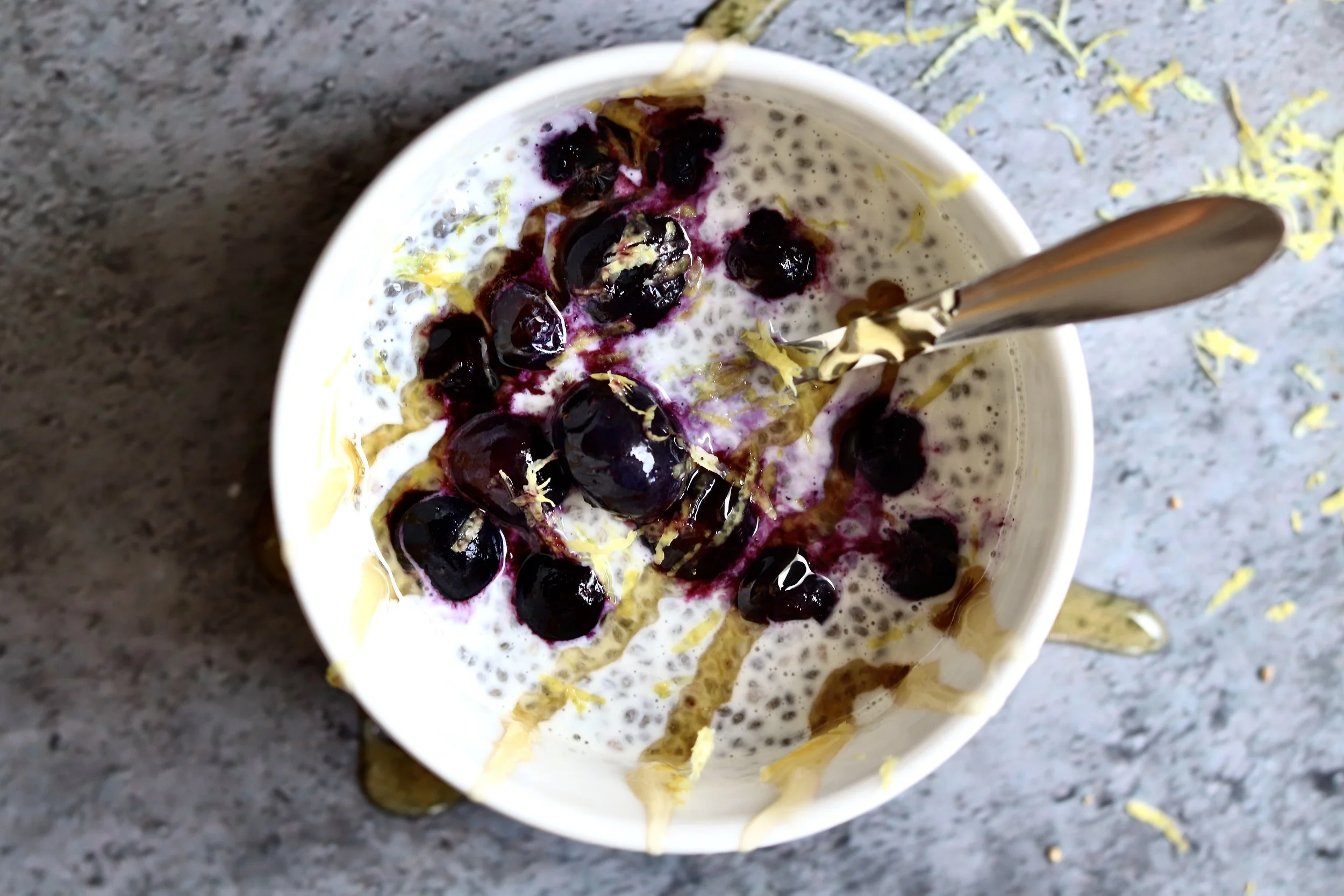 “Kefir lemon chia pudding topped with fresh blueberries in a glass, a creamy and healthy probiotic breakfast”