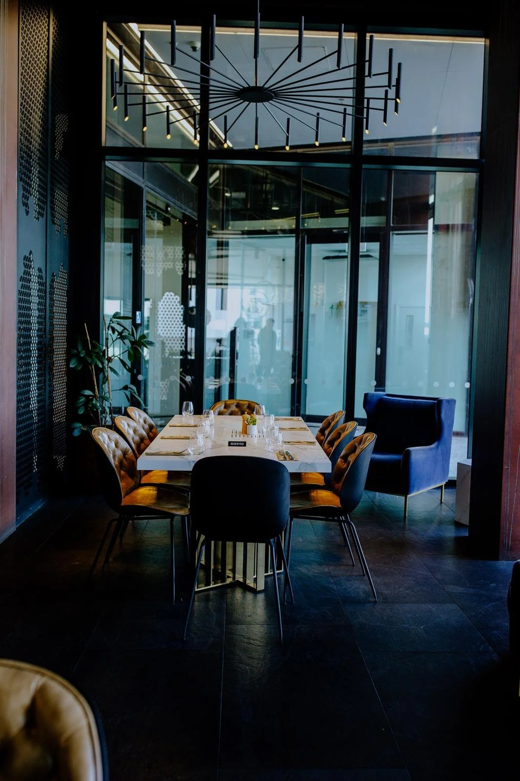 Person pouring champagne into flutes at 55 Café Albany—elegant service for weddings, corporate functions, and private celebrations.