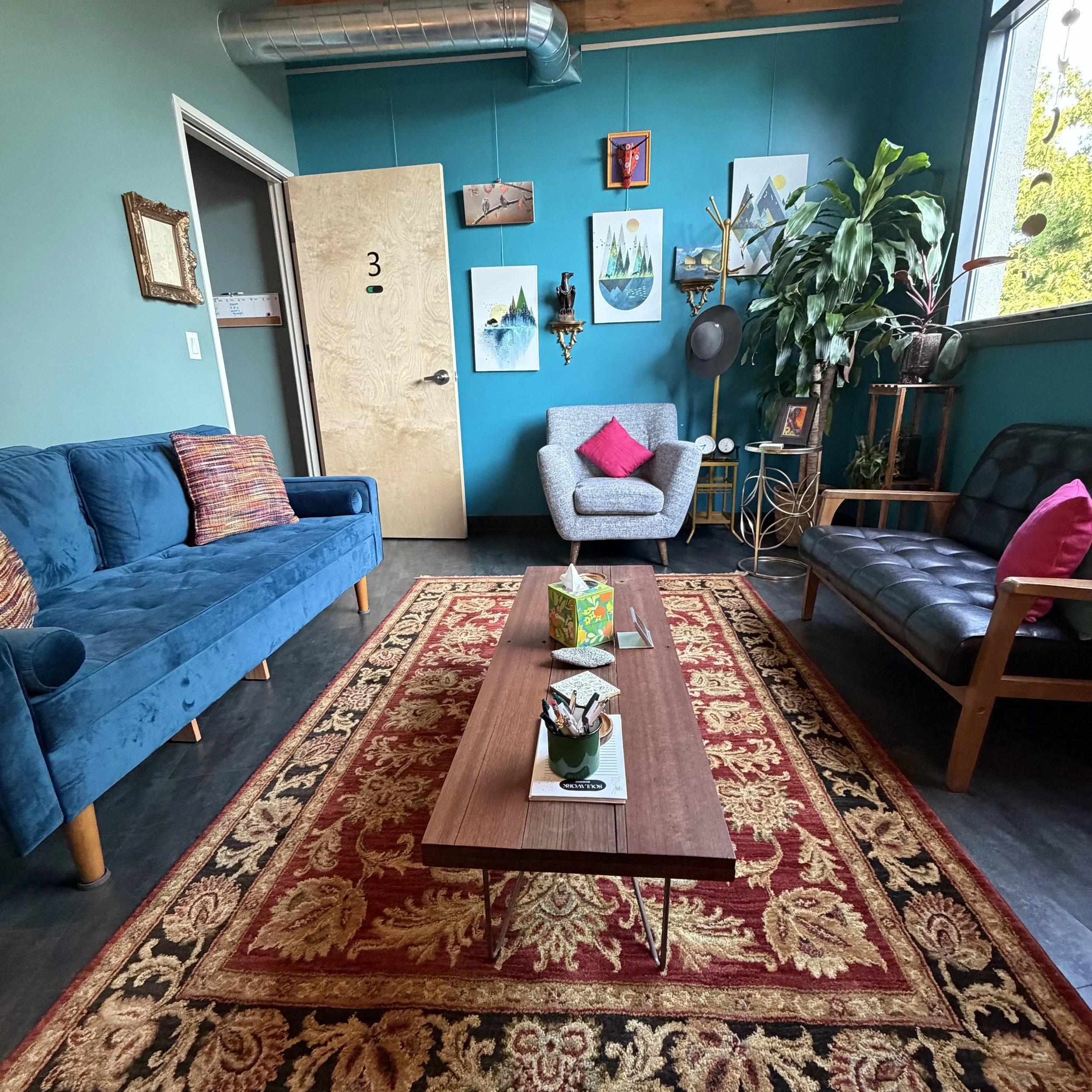 View from West side of room, colorful comfortable space.