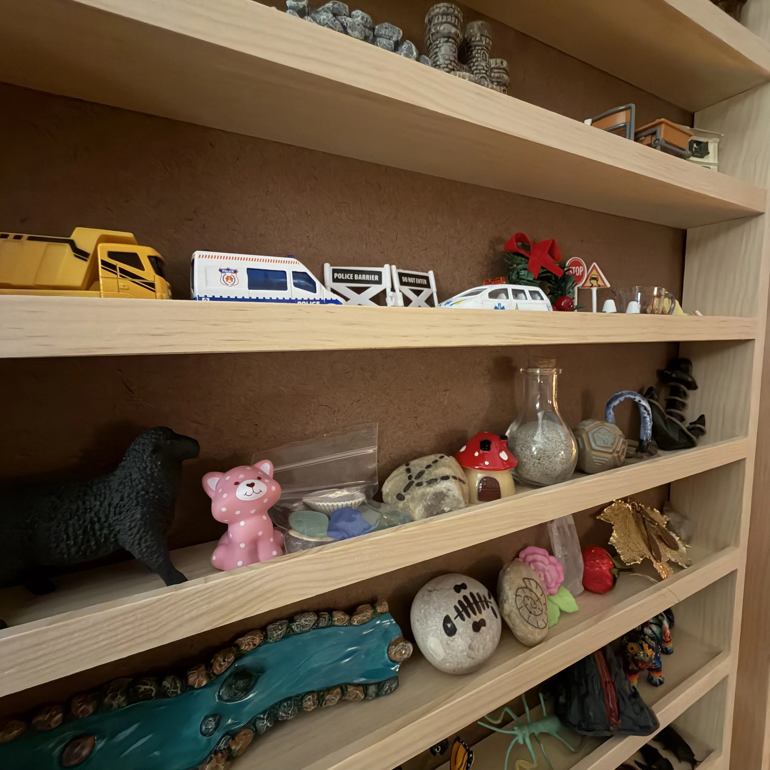 sand tray characters on shelves.JPG
