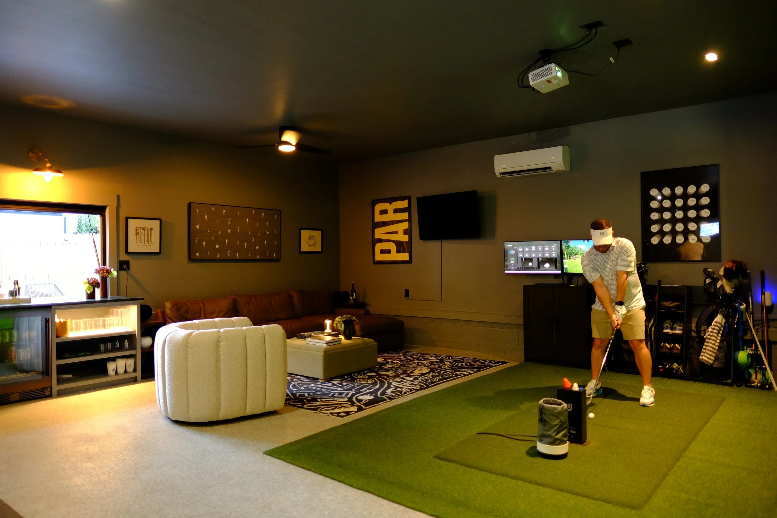 moody golf simulator and living area