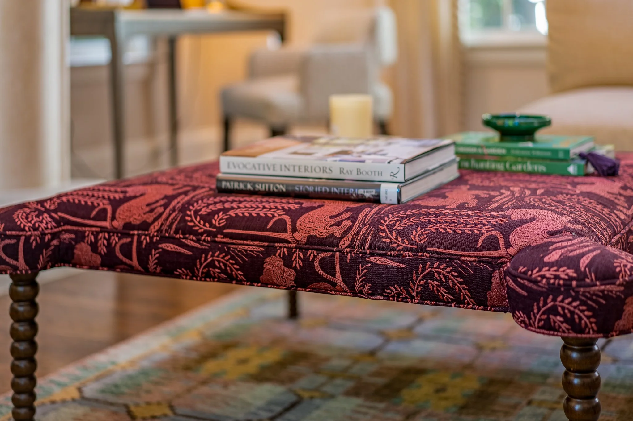 plum color animal print upholstered ottoman