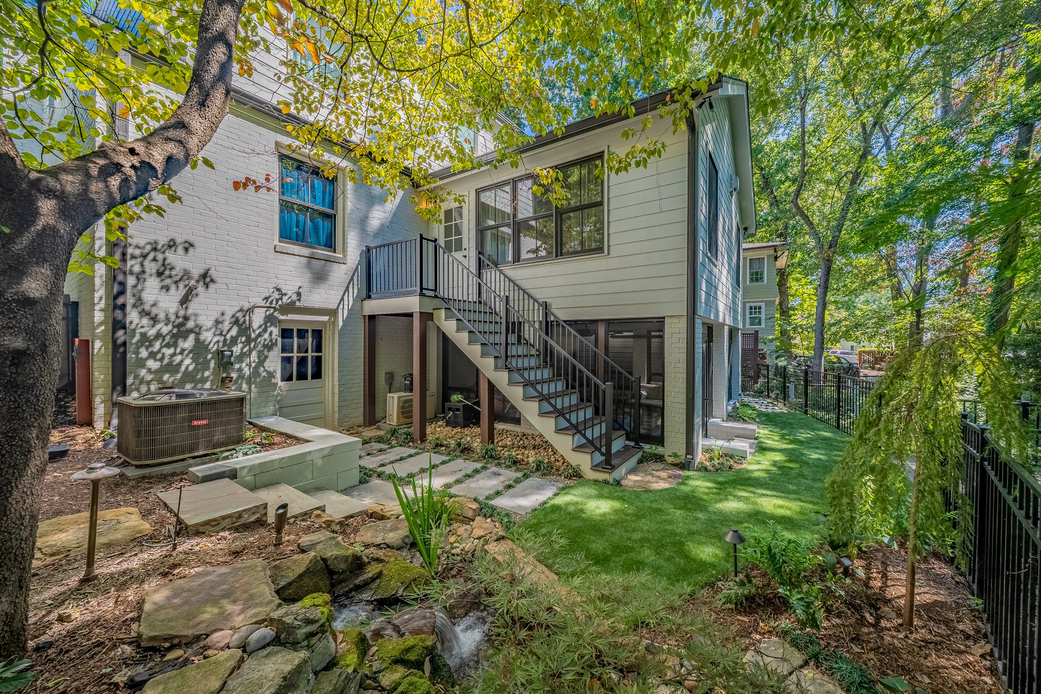 backyard addition with screen porch and fountain