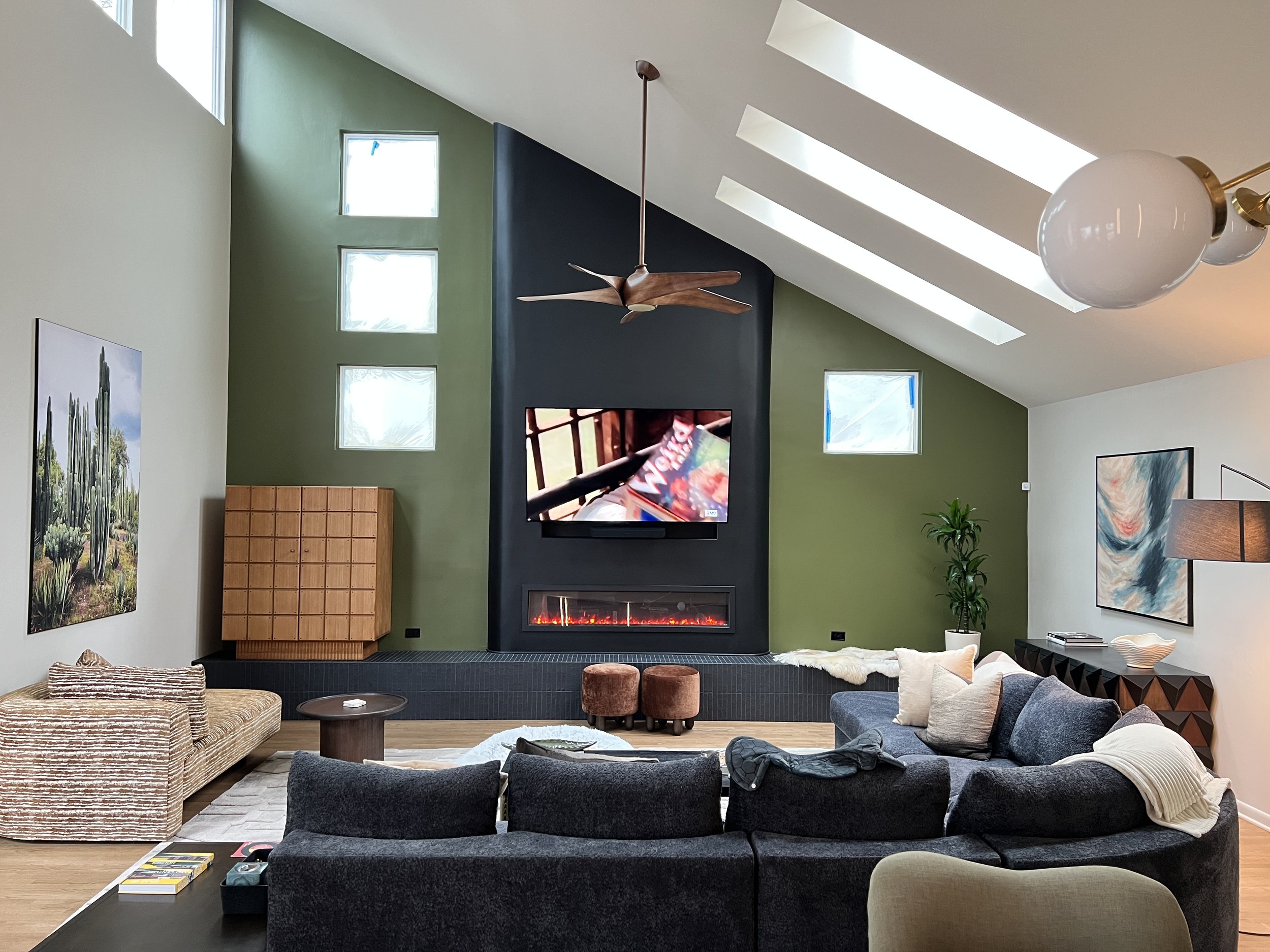 living-room-sloped-ceiling-black-sectional-mid-century-modern-interior-design