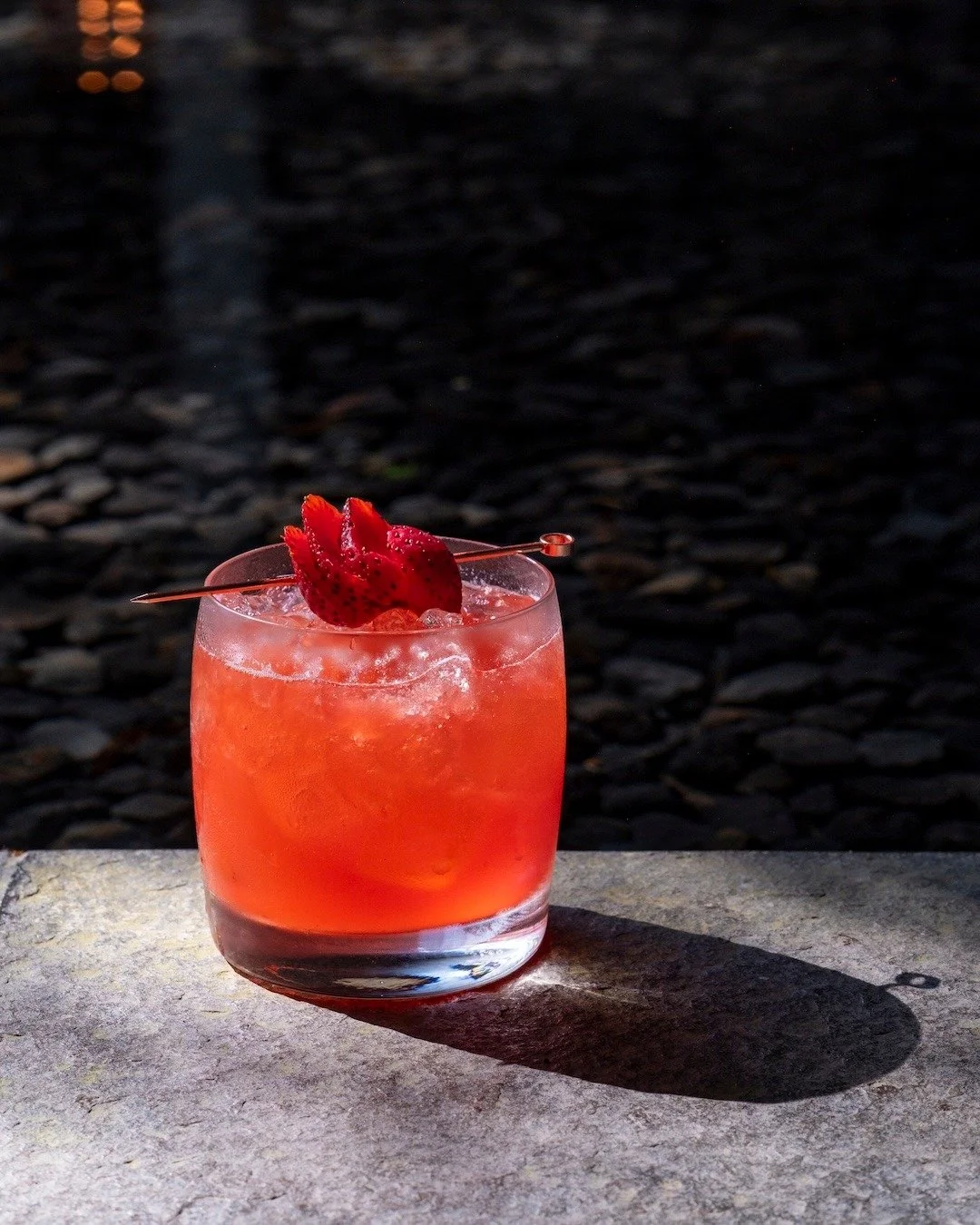 Fragrant mint. A whisper of orange blossom. 🍊🌿 Then comes the sweet tang of ripe strawberries, lifted by sharp lemon zest and softened by a drizzle of yuzu syrup. Each sip of the drink is a balance of brightness and complexity &mdash; smooth, sligh