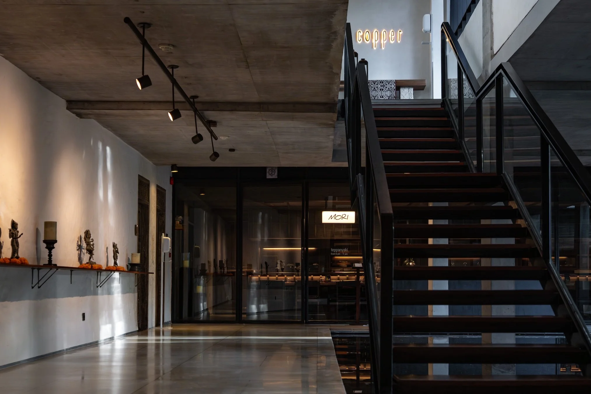 Tucked within Bisma Eight, a one michelin key hotel, and just below the award-winning rooftop restaurant Copper, Mori offers a calm, refined setting before the fire comes to life.

An intimate space where design, atmosphere, and the art of teppanyaki