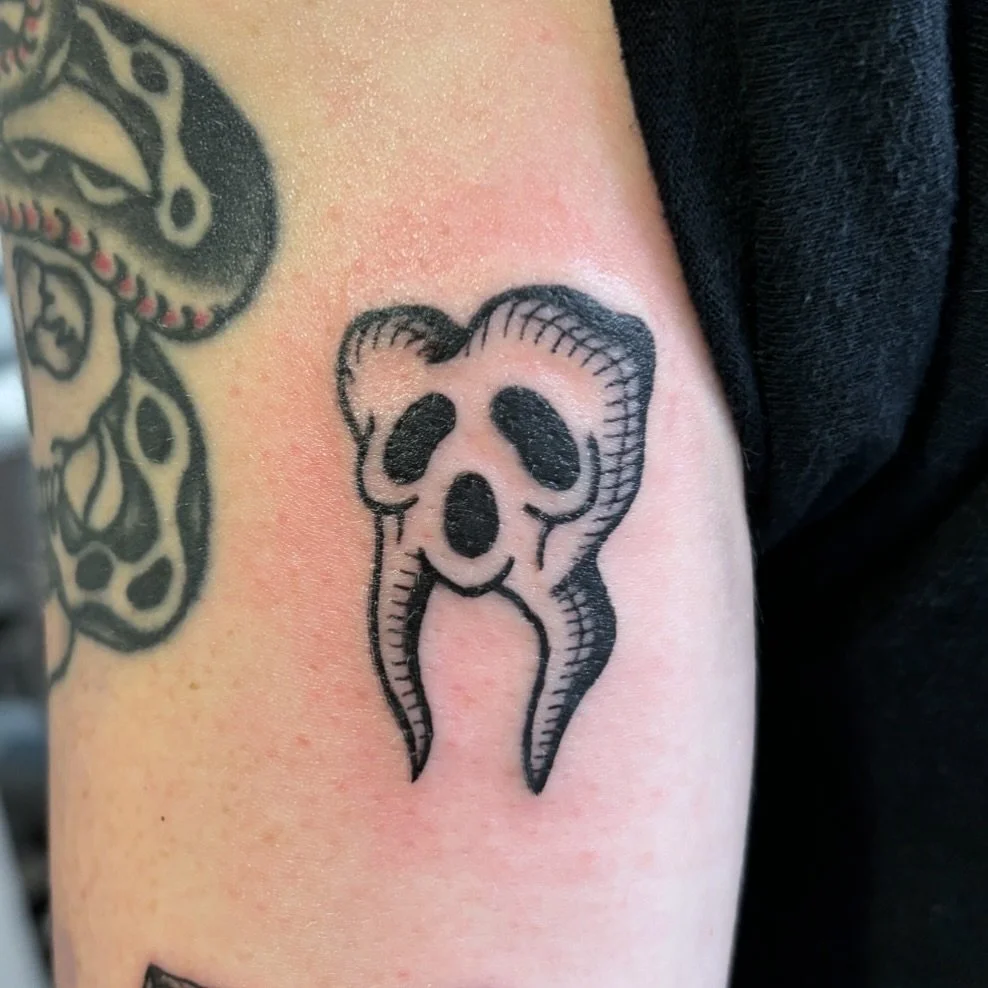 Spoopy tooth for Laura! 
I hope everyone had the best Halloween
Halloween may be over but in my world it&rsquo;s all year round 🖤
DM to book! Your idea or mine 🖤
.
.
.
.
.
.
.
.
.
.
#etching #engraverstyle #blackworktattoo #spookytattoo