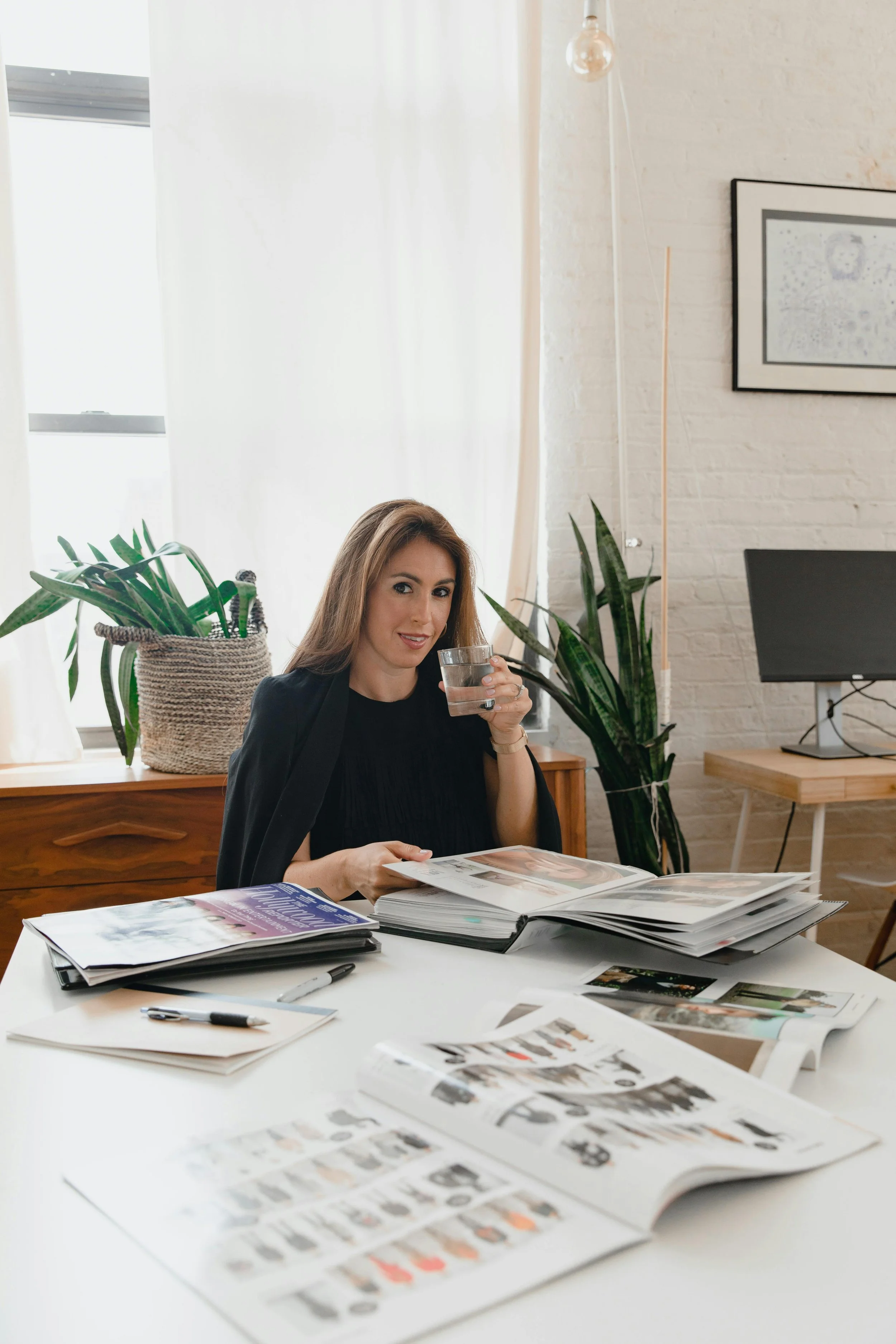 Woman reviewing documents at desk marketing lawyer Sydney