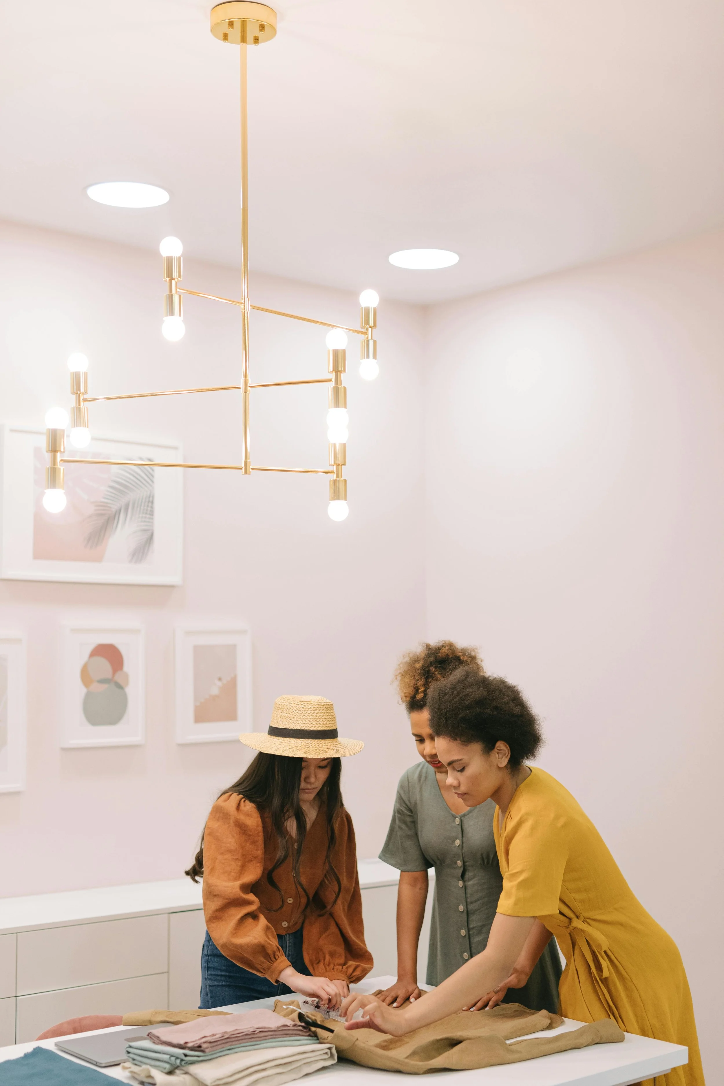 Two women reviewing creative work in design studio intellectual property lawyer Sydney