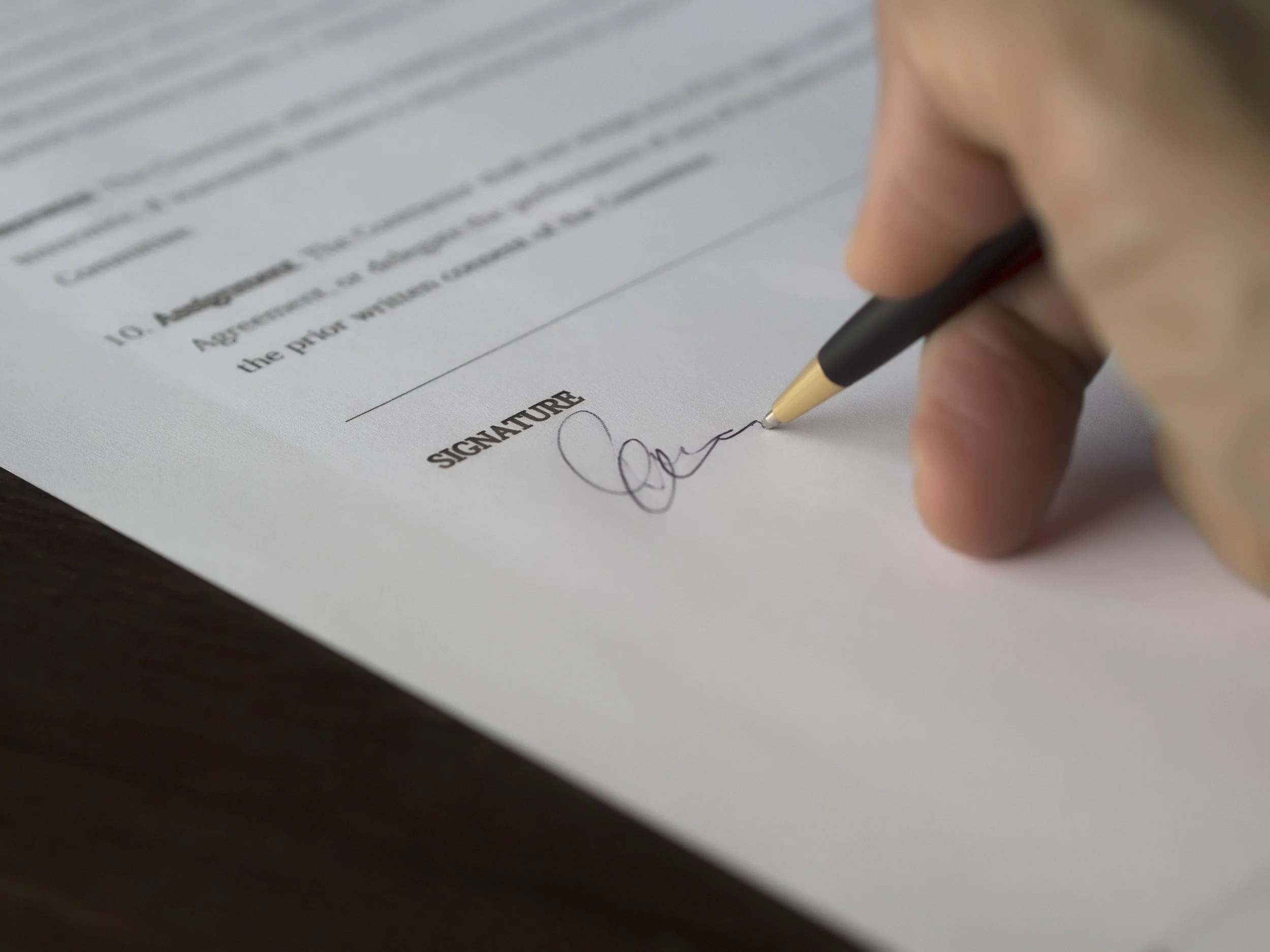 Signature written on contract Sydney lawyer
