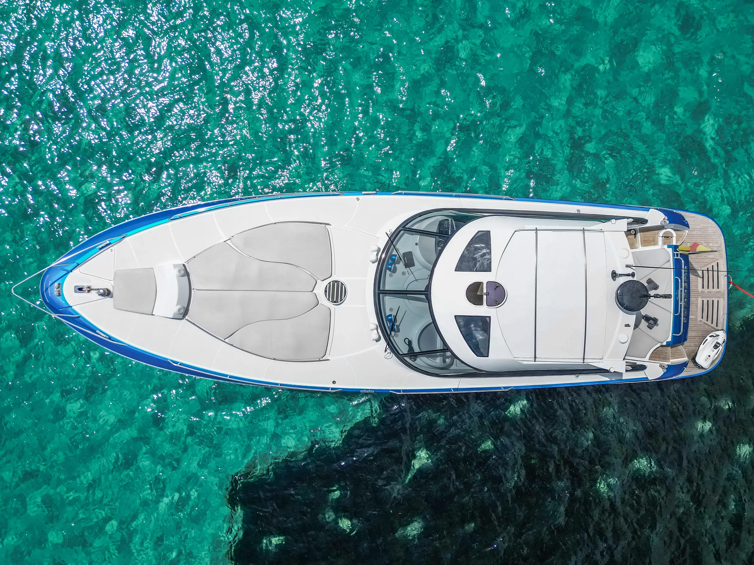 Baia 54 Surreal viewed directly from above floating over shallow turquoise water.