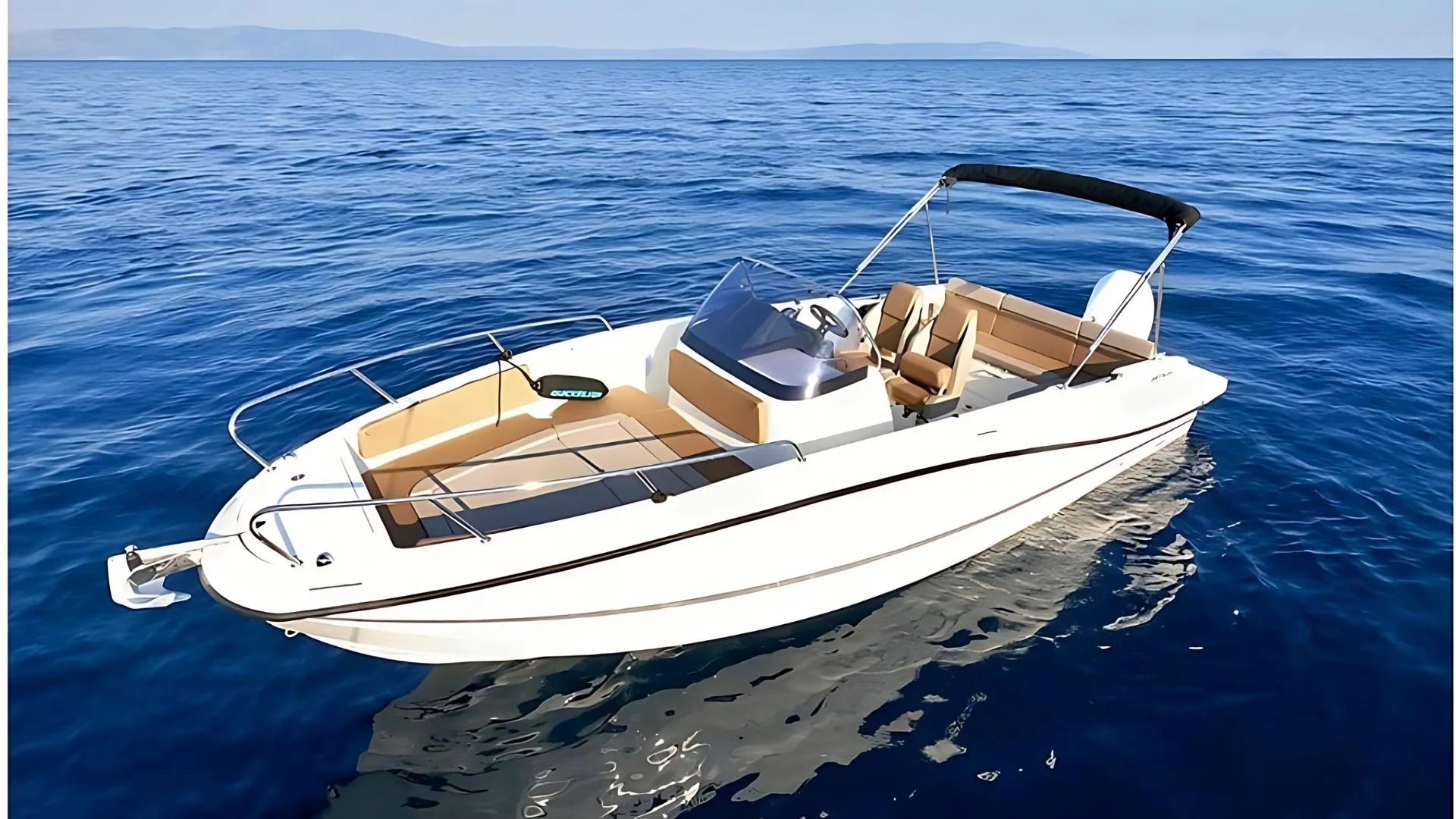 Small motorboat on calm blue ocean