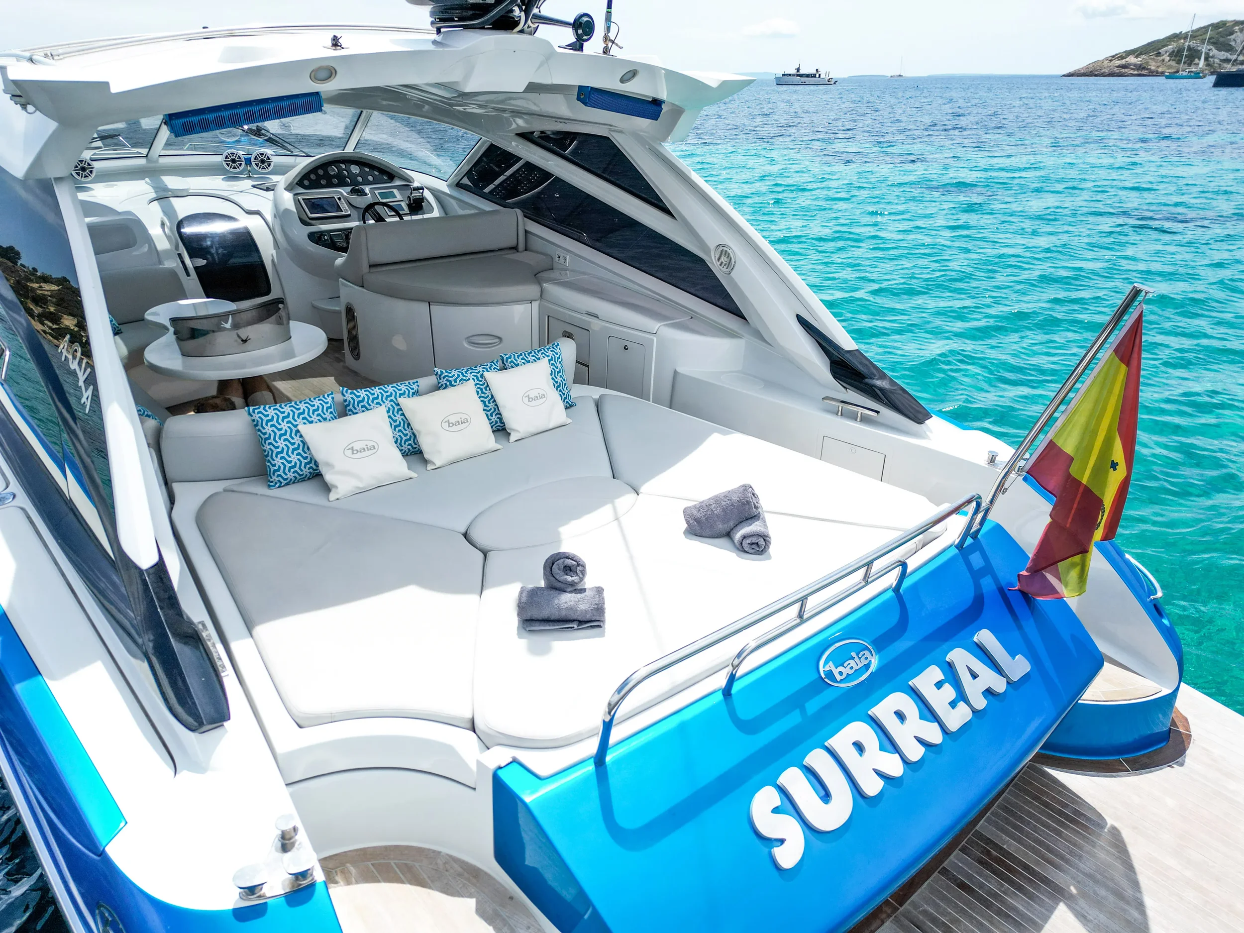Baia 54 Surreal aft lounge and seating area prepared for relaxed cruising around Ibiza.