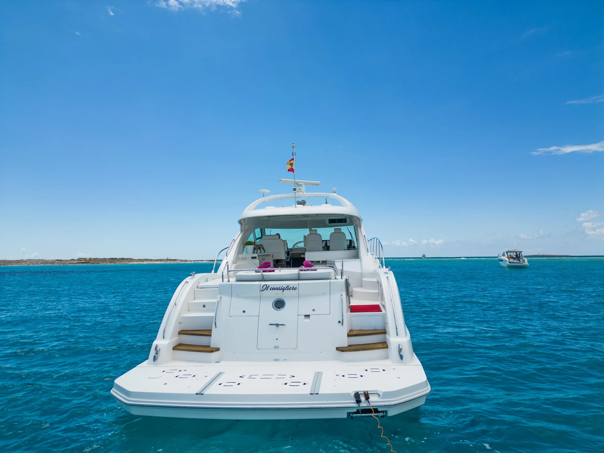 Sea Ray 55 Il Consigliere featuring its rear sunbed lounge while anchored in Ibiza