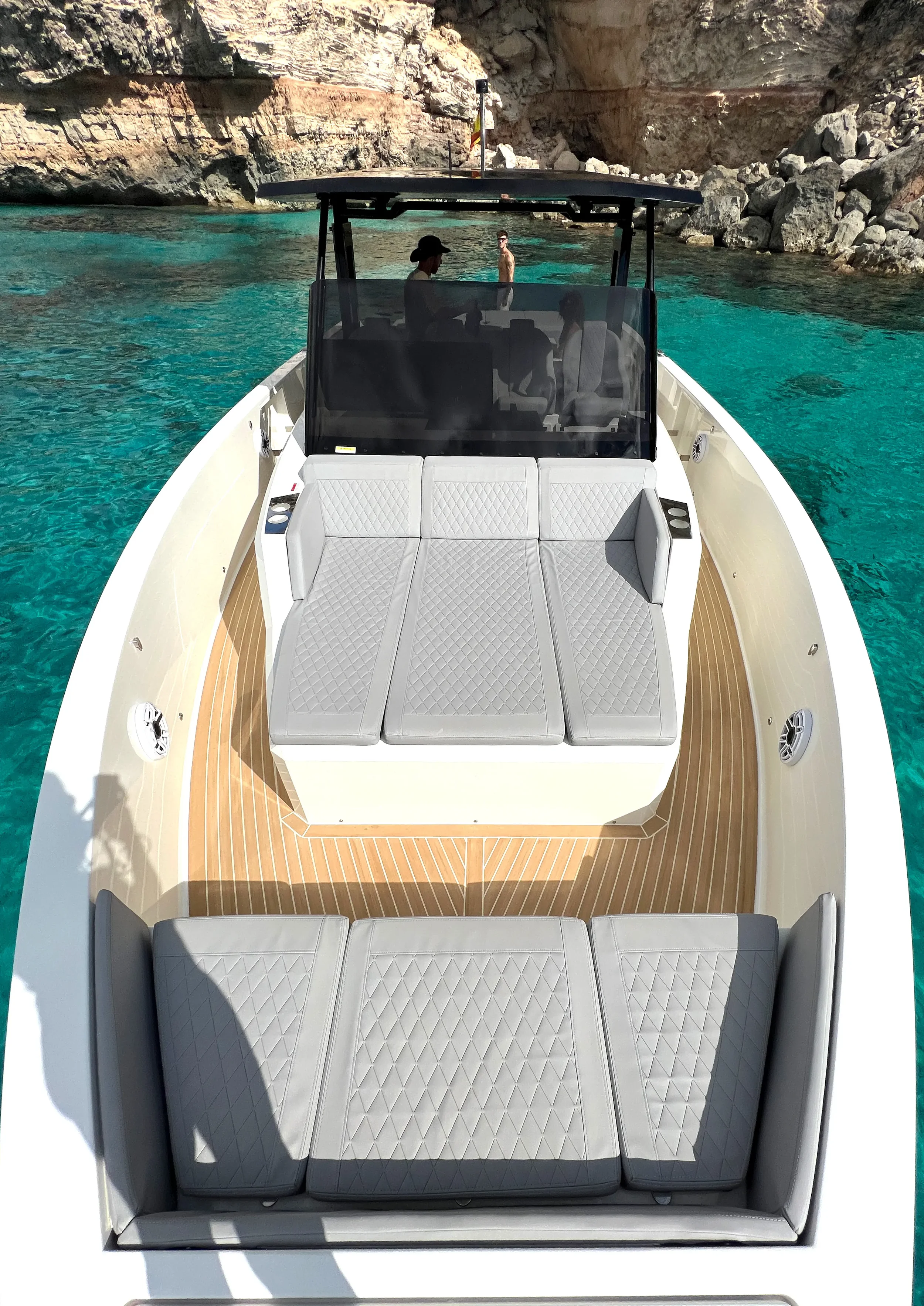 De Antonio 42 Tot Suma showing the bow sunbed area with soft cushions and calm sea ahead.