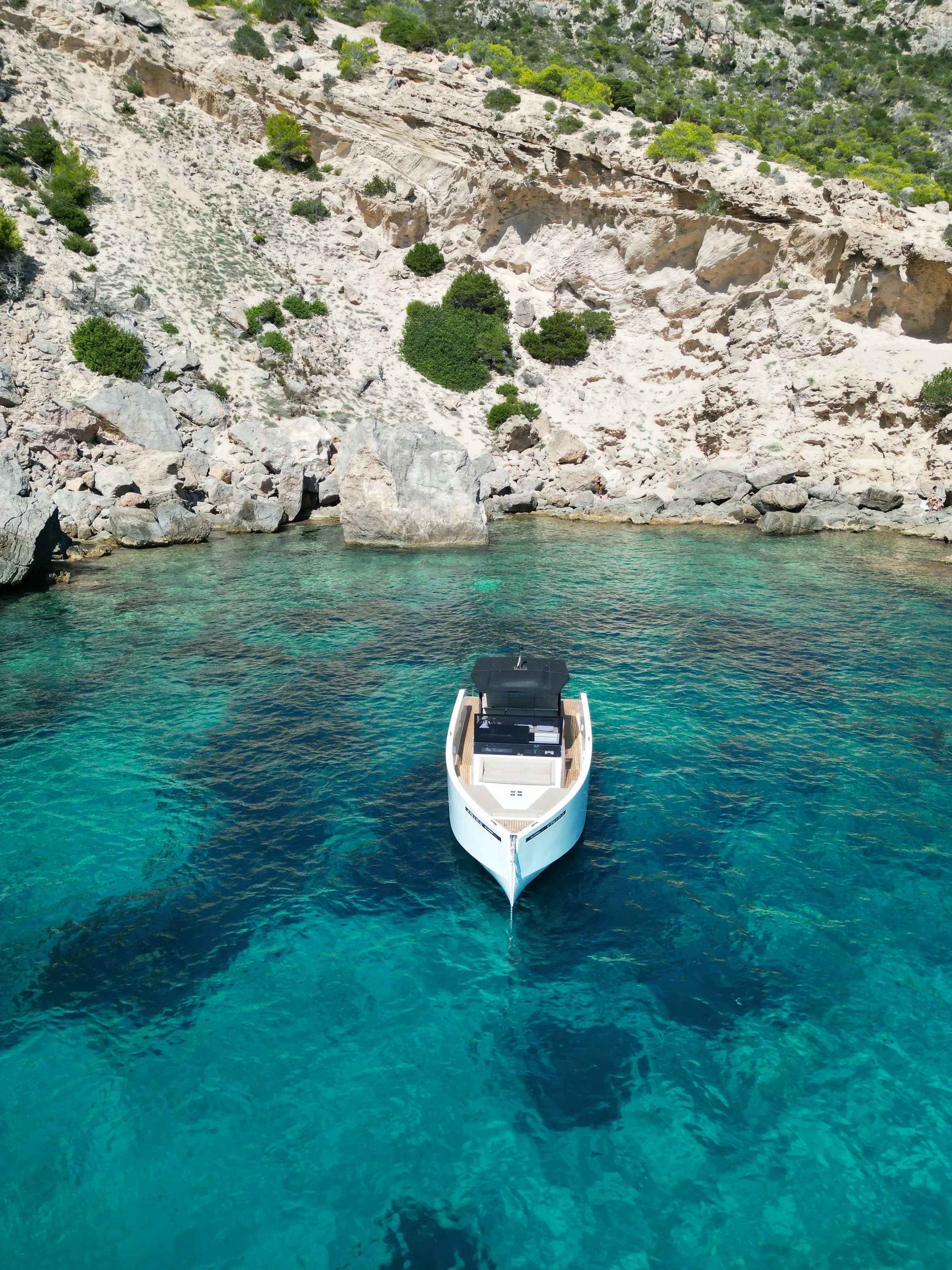 De Antonio 34 Gogga bow view anchored in a quiet turquoise cove