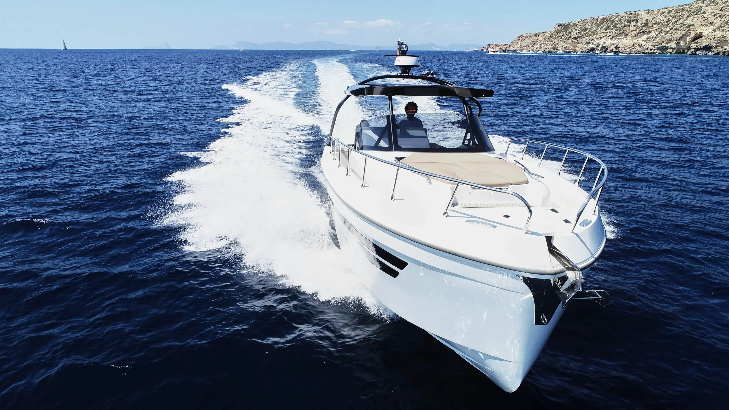 Oryx 38 Santa Cruz cruising at speed over deep blue Ibiza water