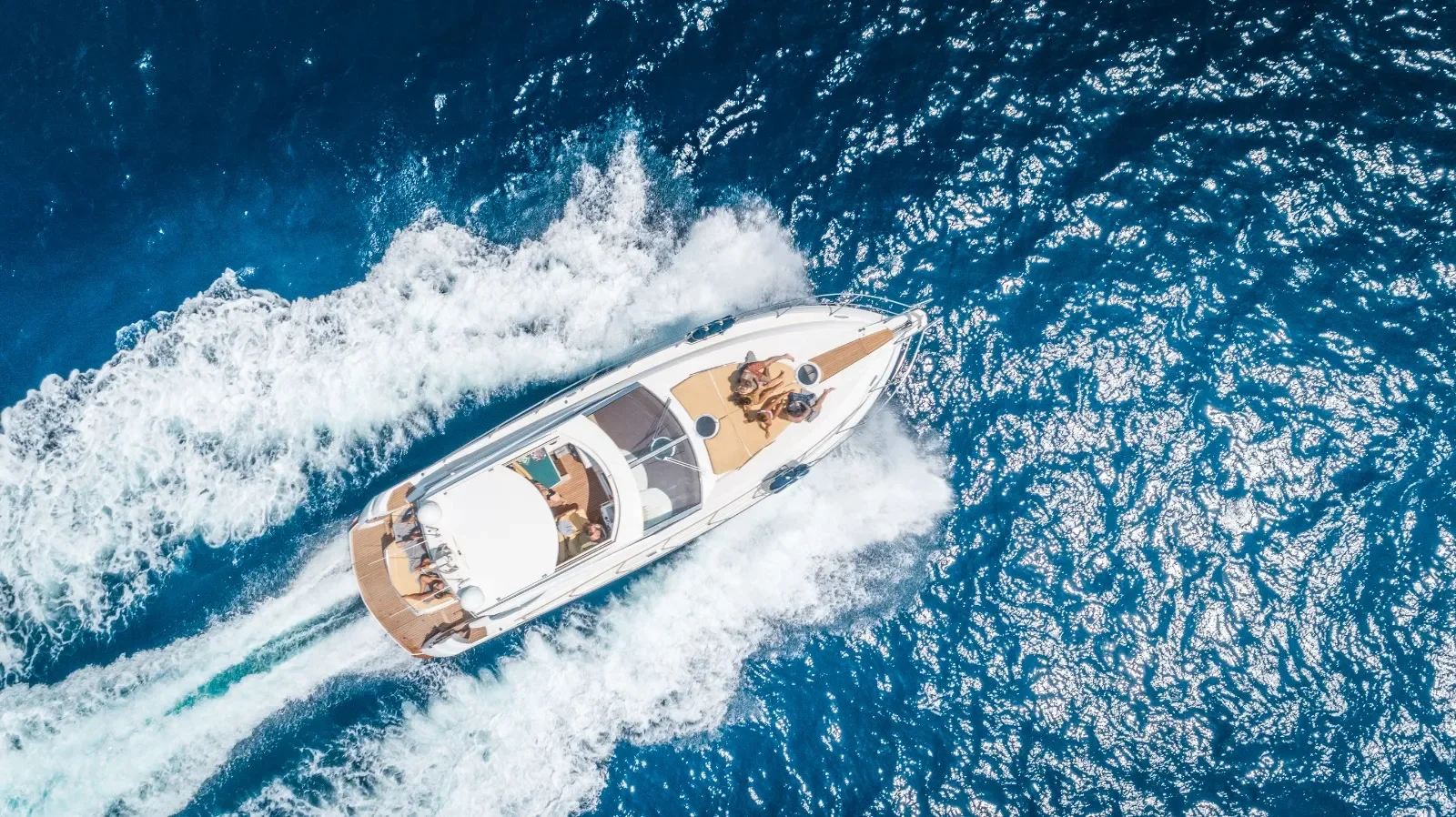 Sessa Marine 52 viewed directly from above cutting smoothly through deep blue Mediterranean water