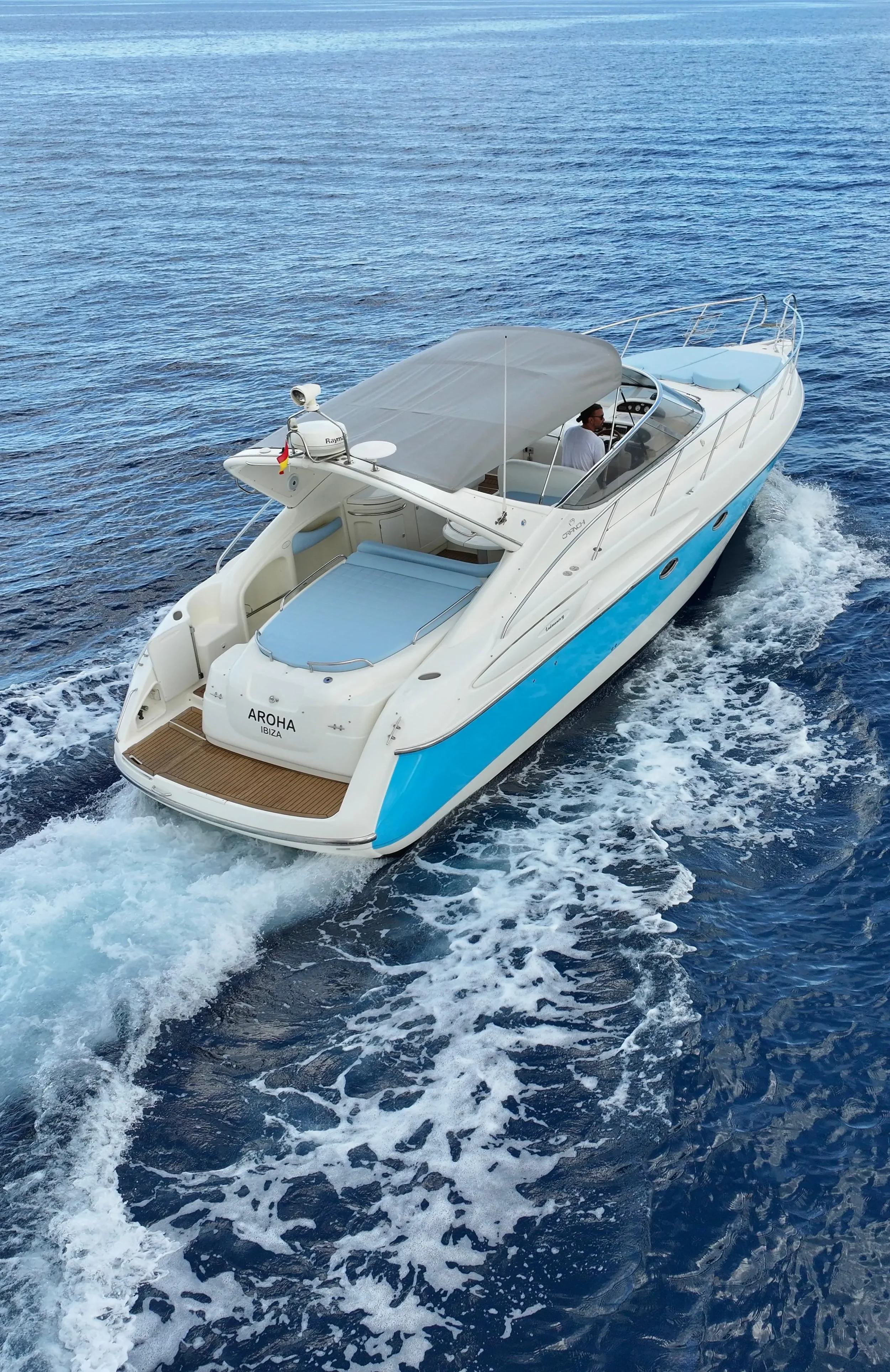 Cranchi Endurance 39 Aroha Ibiza cruising at speed through clear Ibiza water