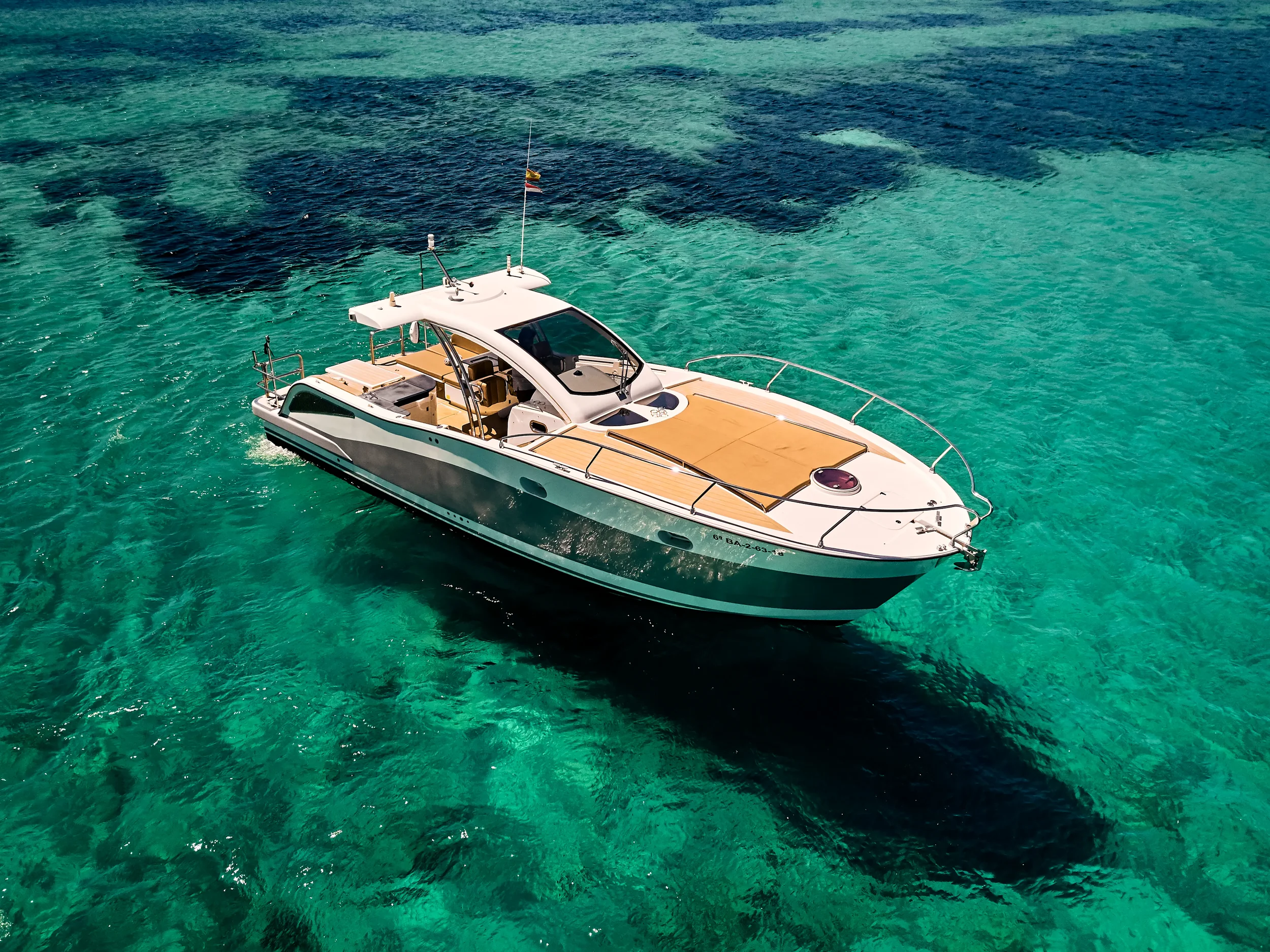 Astromar Xsea 42 anchored over crystal clear water showing spacious bow sunbathing area