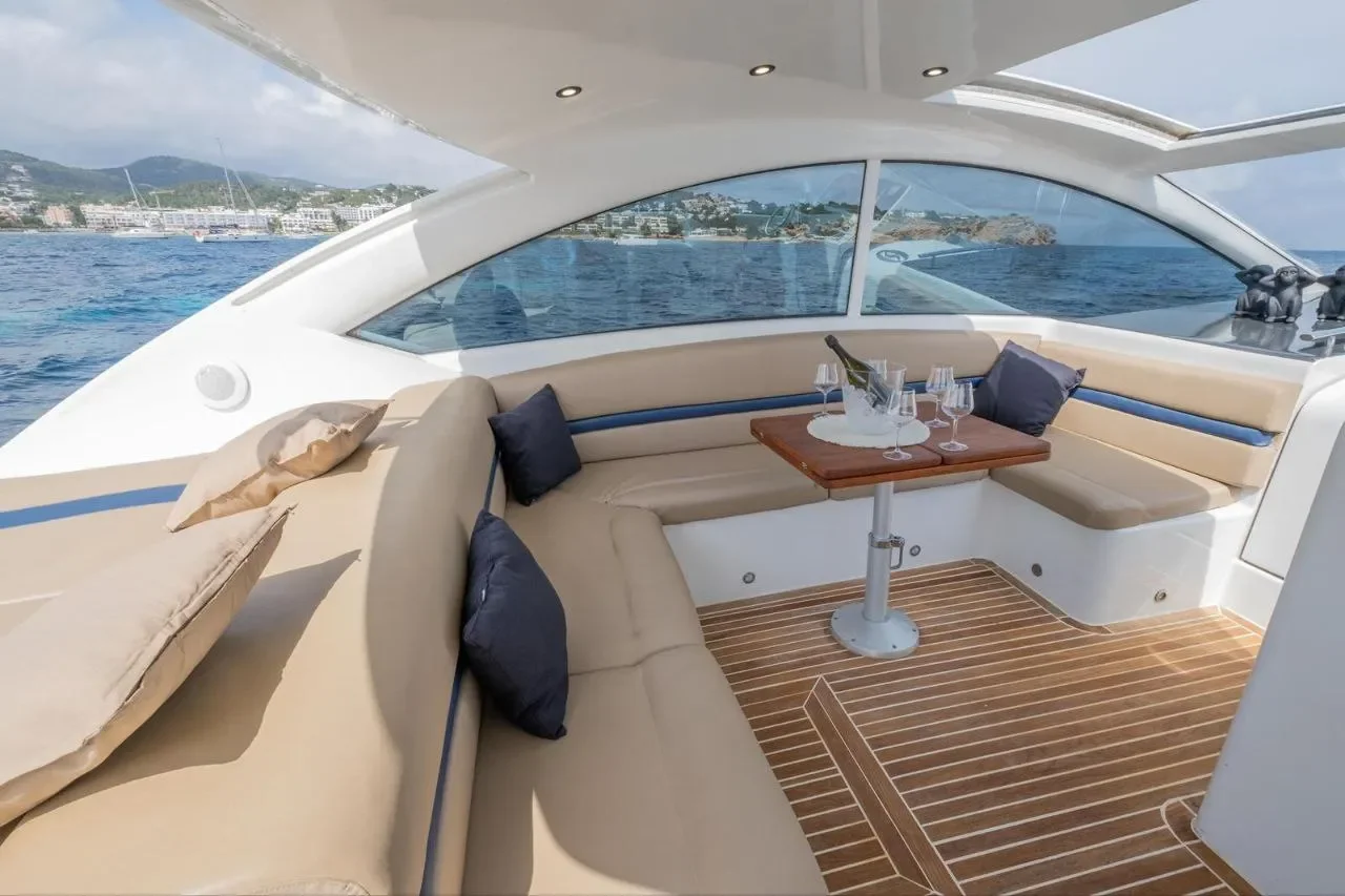 Numarine 55 Bewitched cockpit seating area with table and shaded outdoor lounge