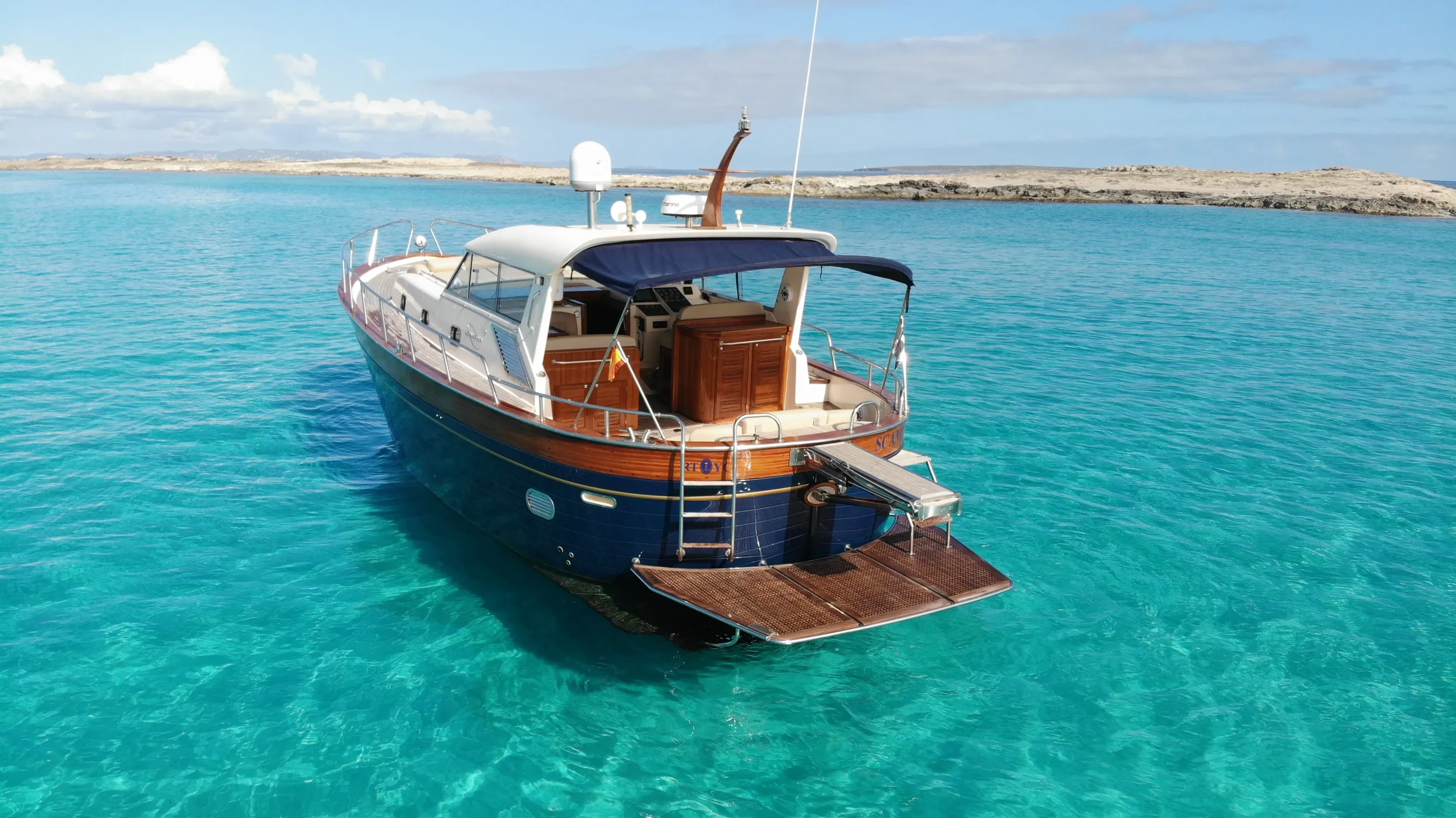 apreamare 45 scamp anchored peacefully with the swim platform open and inviting access to the water.