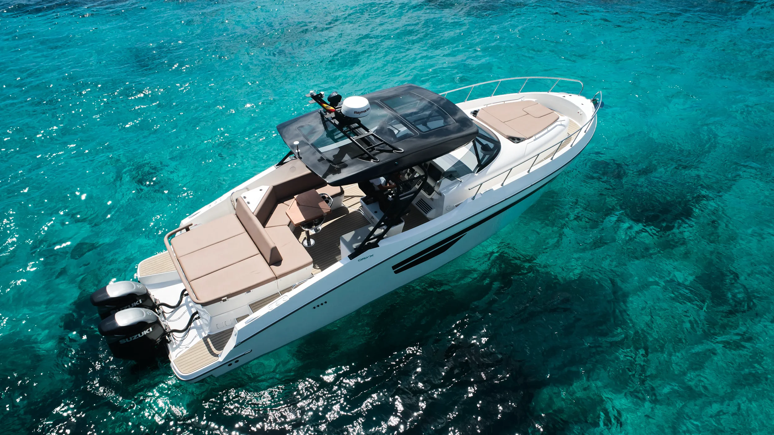 Oryx 38 Santa Cruz angled side view showing spacious deck and sunbeds