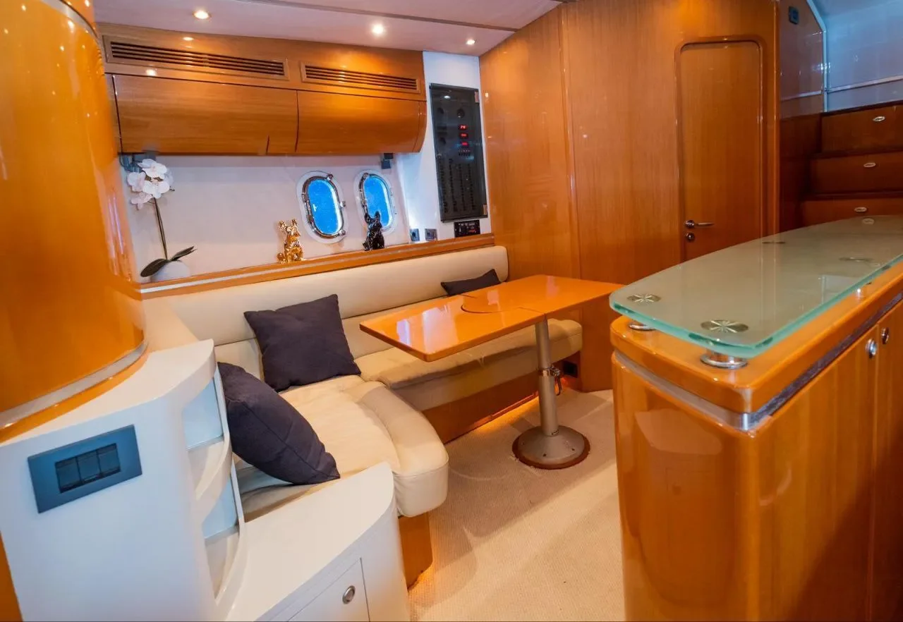 Numarine 55 Bewitched interior dining and lounge area with warm wood finishes and seating