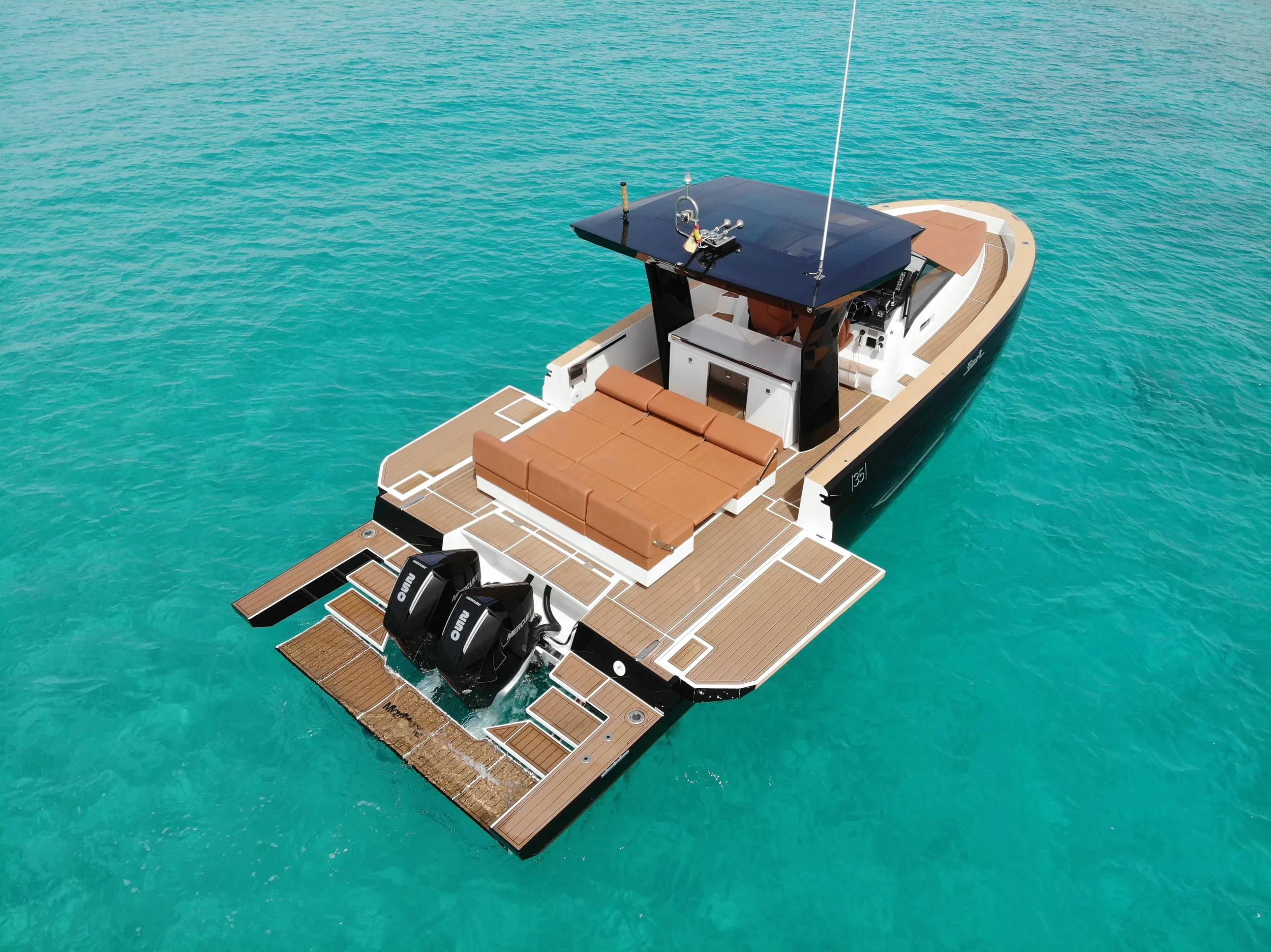 Fiart 35 Martone anchored in shallow turquoise water with wide deck layout