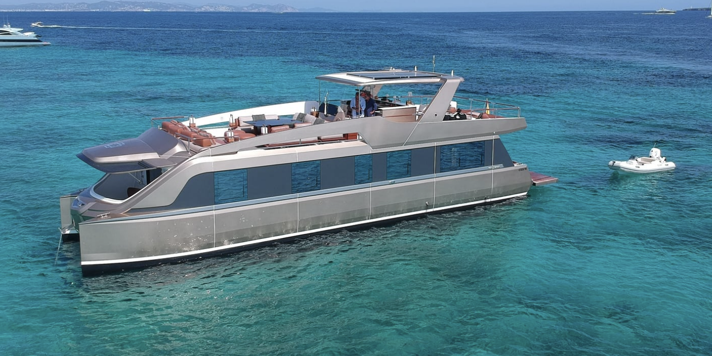 Luxury yacht on turquoise sea with inflatable boat